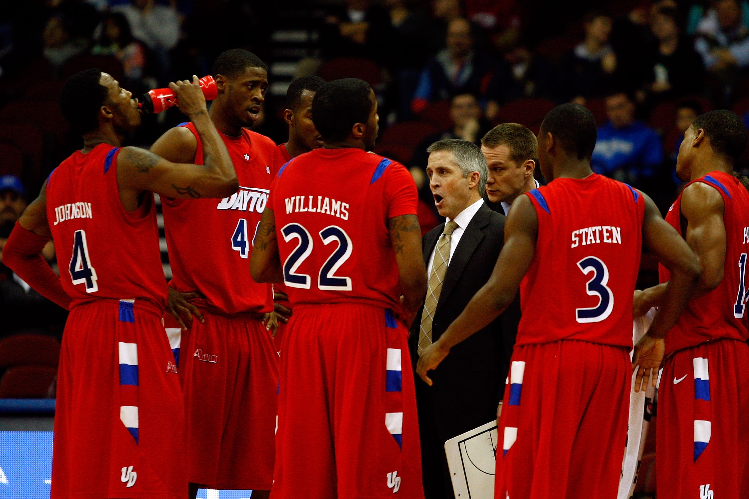 NEWARK, NJ - DECEMBER 22:  Head coach Brian Gregory of the Dayton Flyers talks with his players during a timeout against the Seton Hall Pirates at Prudential Center on December 22, 2010 in Newark, New Jersey.  (Photo by Chris Chambers/Getty Images)