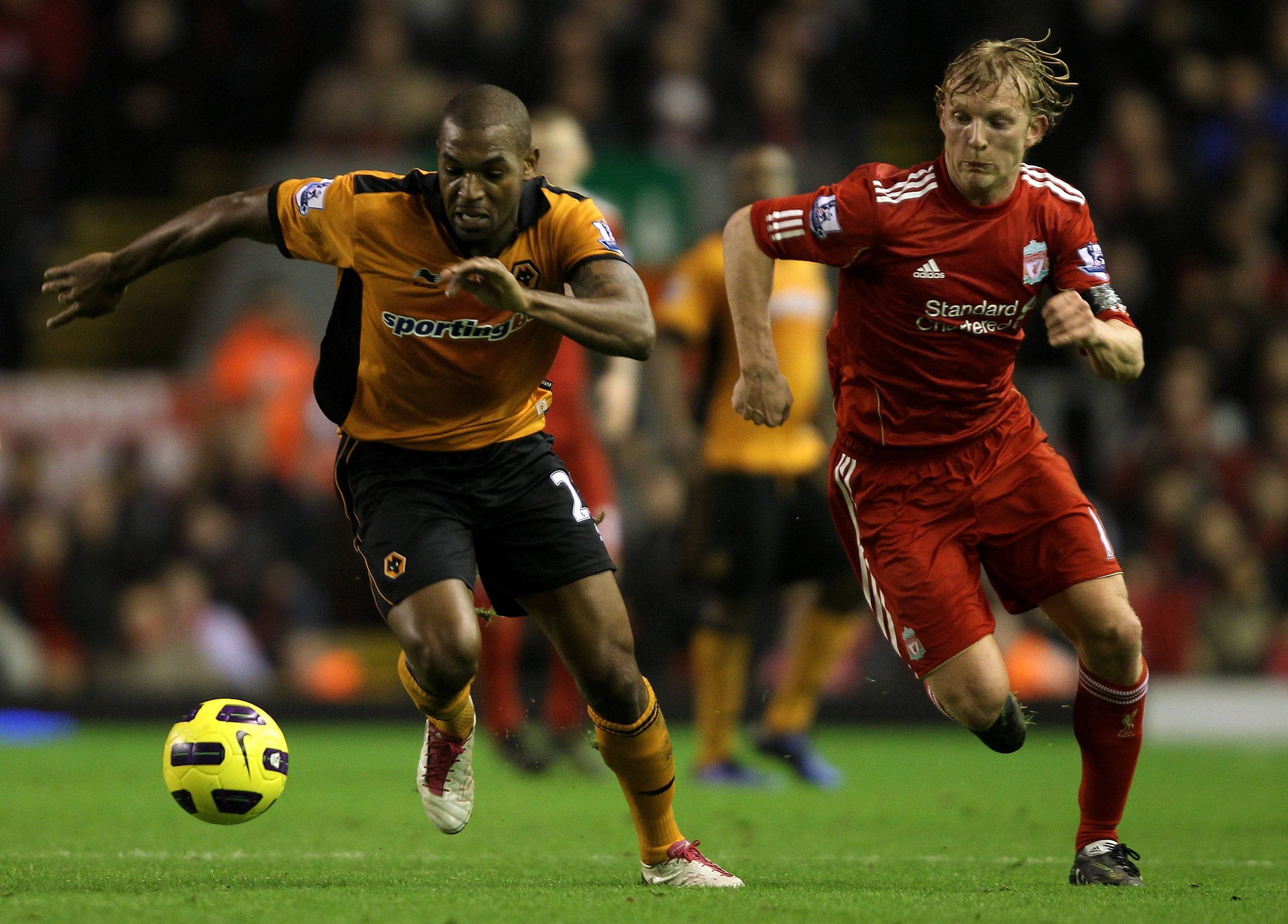 LIVERPOOL, ENGLAND - DECEMBER 29:  Dirk Kuyt of Liverpool competes with Ronald Zubar of Wolverhampton Wanderers during the Barclays Premier League match between Liverpool and Wolverhampton Wanderers at Anfield on December 29, 2010 in Liverpool, England.