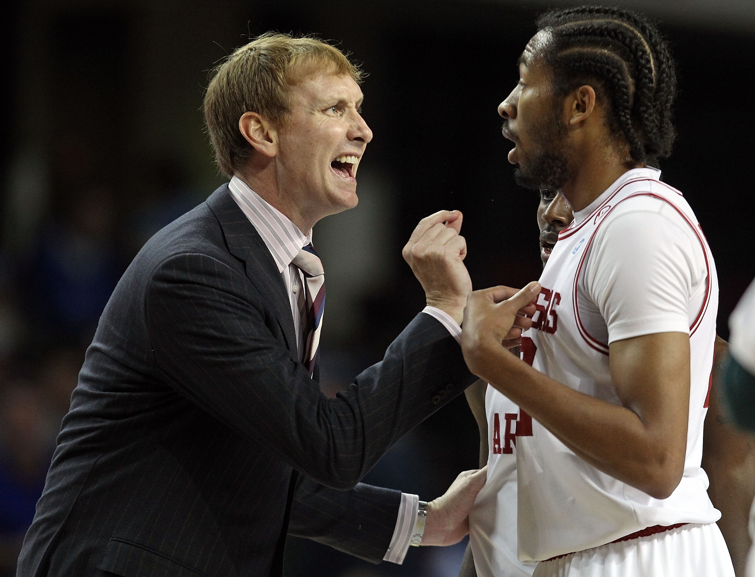 LOUISVILLE, KY - DECEMBER 08:  John Pelphrey the Head Coach of the Arkansas Razorbacks gives instructions to Marvelle Waithe #22 during the game against the Seton Hall Pirates in the 2010 DIRECTV SEC/BIG EAST Invitational at Freedom Hall on December 8, 20