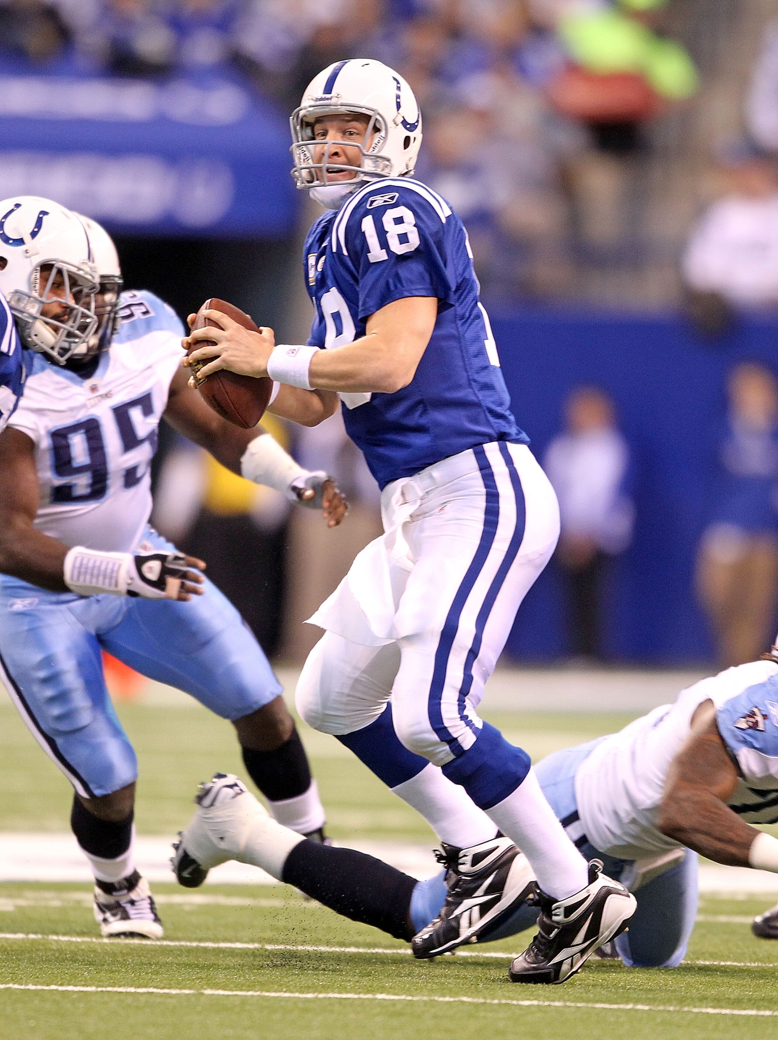 INDIANAPOLIS - JANUARY 02:  Peyton Manning #18 of the Indianapolis Colts looks to pass the ball during NFL game against the Tennessee Titans at Lucas Oil Stadium on January 2, 2011 in Indianapolis, Indiana.  (Photo by Andy Lyons/Getty Images)
