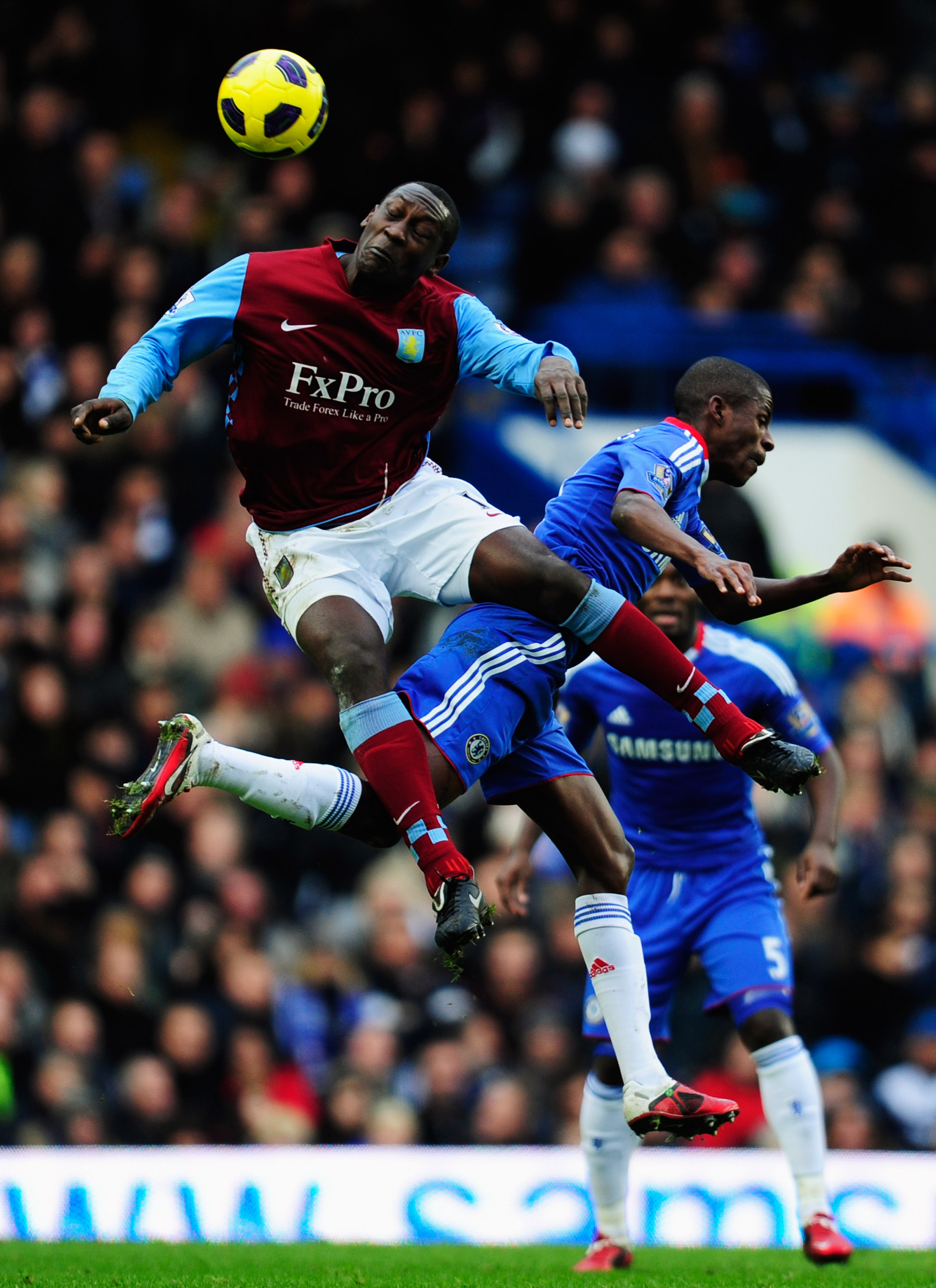 LONDON, ENGLAND - JANUARY 02:  Ramires of Chelsea jumps with Emile Heskey of Aston Villa during the Barclays Premier League match between Chelsea and Aston Villa at Stamford Bridge on January 2, 2011 in London, England.  (Photo by Jamie McDonald/Getty Ima
