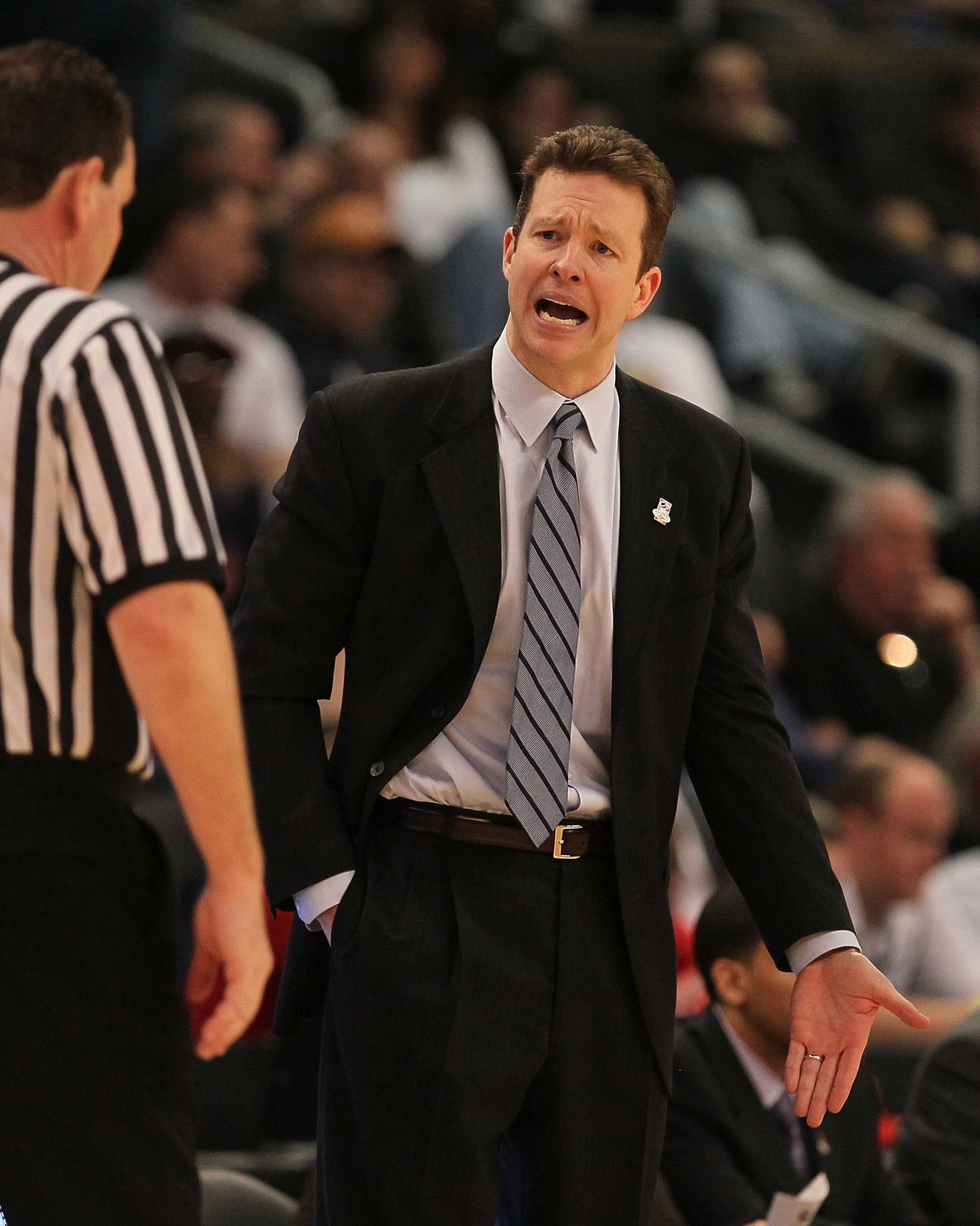 PROVIDENCE, RI - MARCH 18:  Coach Chris Mooney of the Richmond Spiders reacts to an official's call against the Saint Mary's Gaels during the first round of the 2010 NCAA men's basketball tournament at Dunkin' Donuts Center on March 18, 2010 in Providence