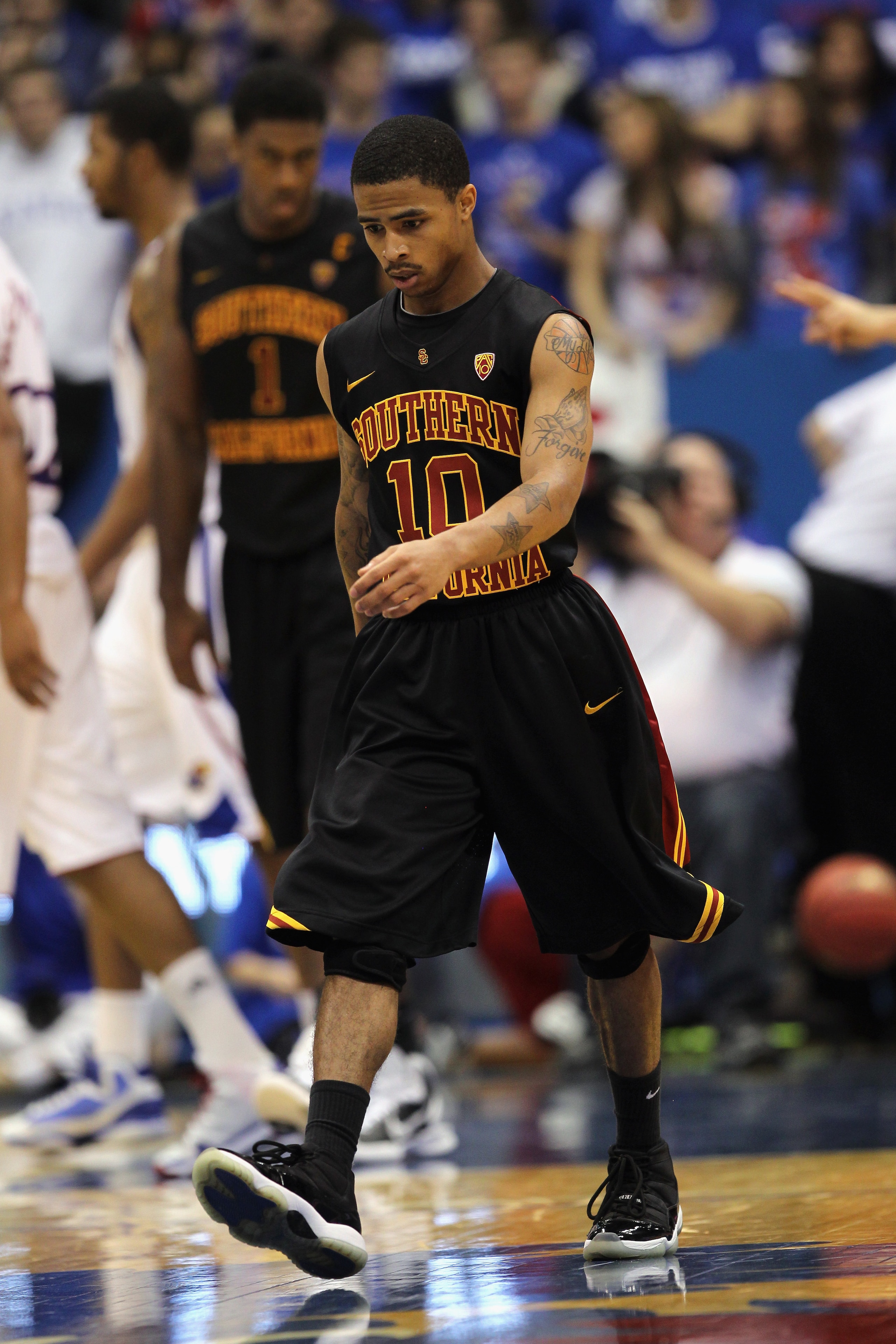 LAWRENCE, KS - DECEMBER 18:  Maurice Jones #10 of the USC Trojans walks off the court during a timeout in the game against the Kansas Jayhawks on December 18, 2010 at Allen Fieldhouse in Lawrence, Kansas.  (Photo by Jamie Squire/Getty Images)