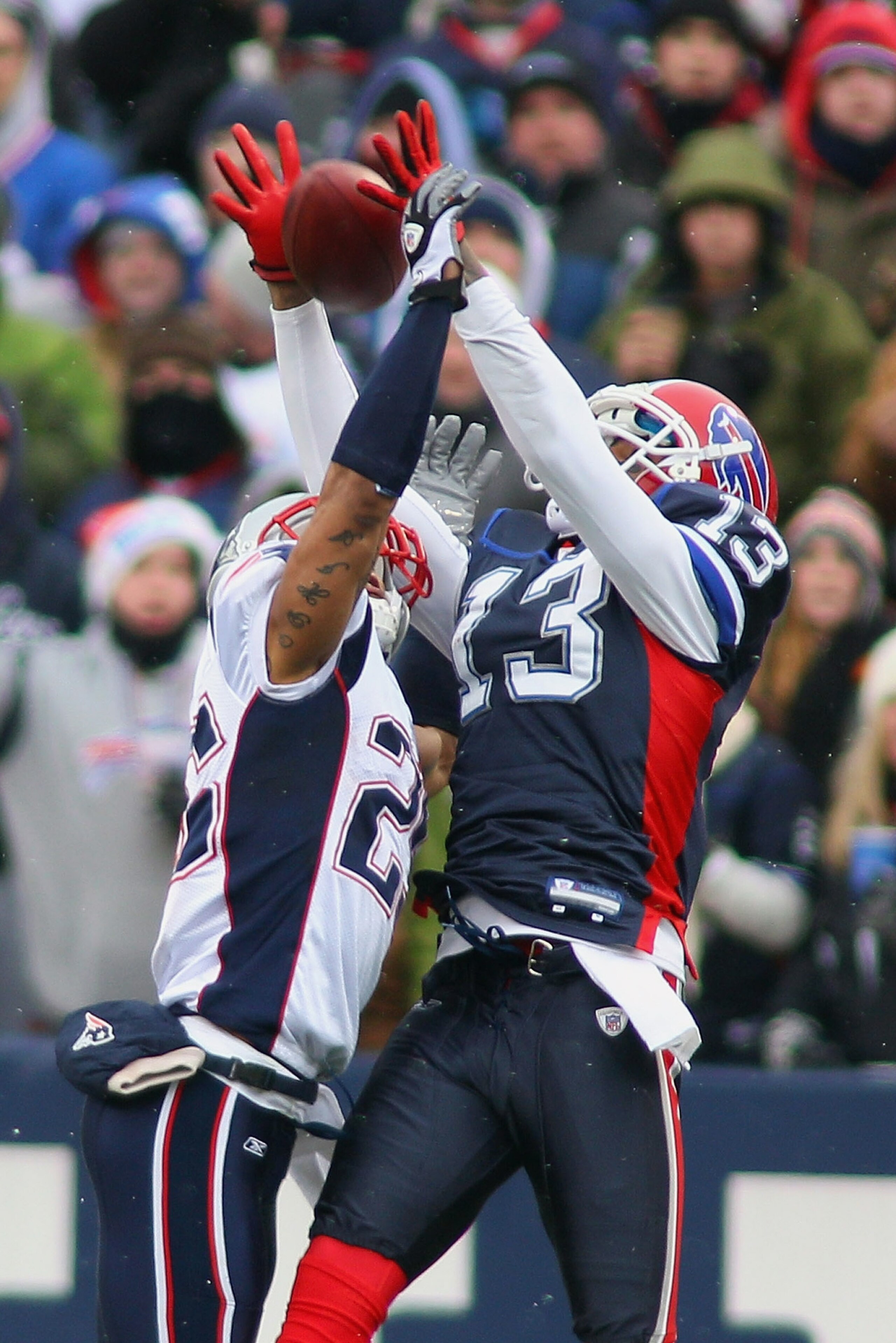 ORCHARD PARK, NY - DECEMBER 26: Patrick Chung #25 of the Patriots applies pressure on a pass intended for Steve Johnson #13 of the Buffalo Bills at Ralph Wilson Stadium on December 26, 2010 in Orchard Park, New York.  (Photo by Rick Stewart/Getty Images)