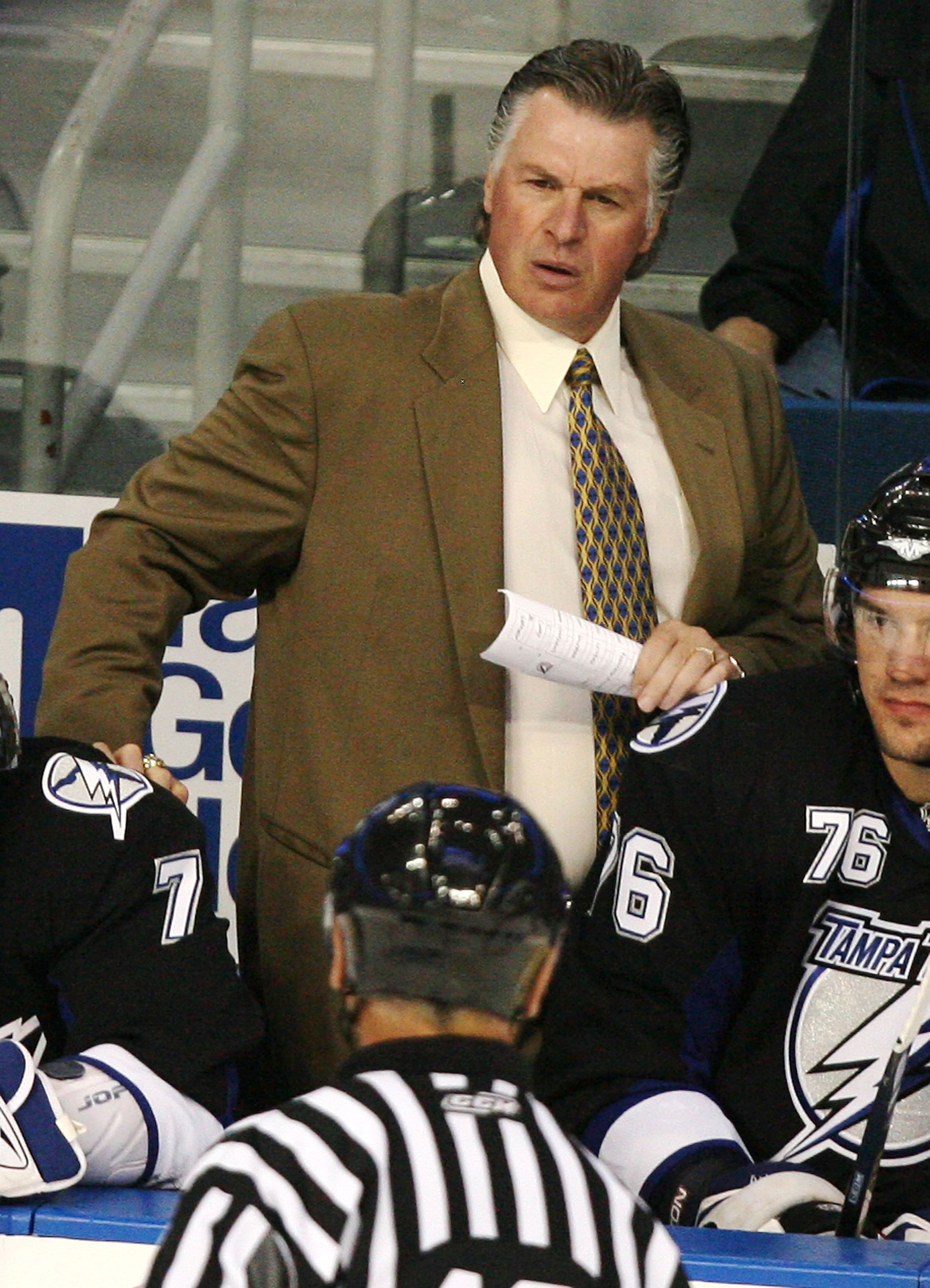 TAMPA, FL - SEPTEMBER 22:  Head coach Barry Melrose of the Tampa Bay Lightning discusses a call with referee Don Koharski during action against the Pittsburgh Penguins in a preseasono game at the St. Pete Times Forum September 22, 2008 in Tampa, Florida.
