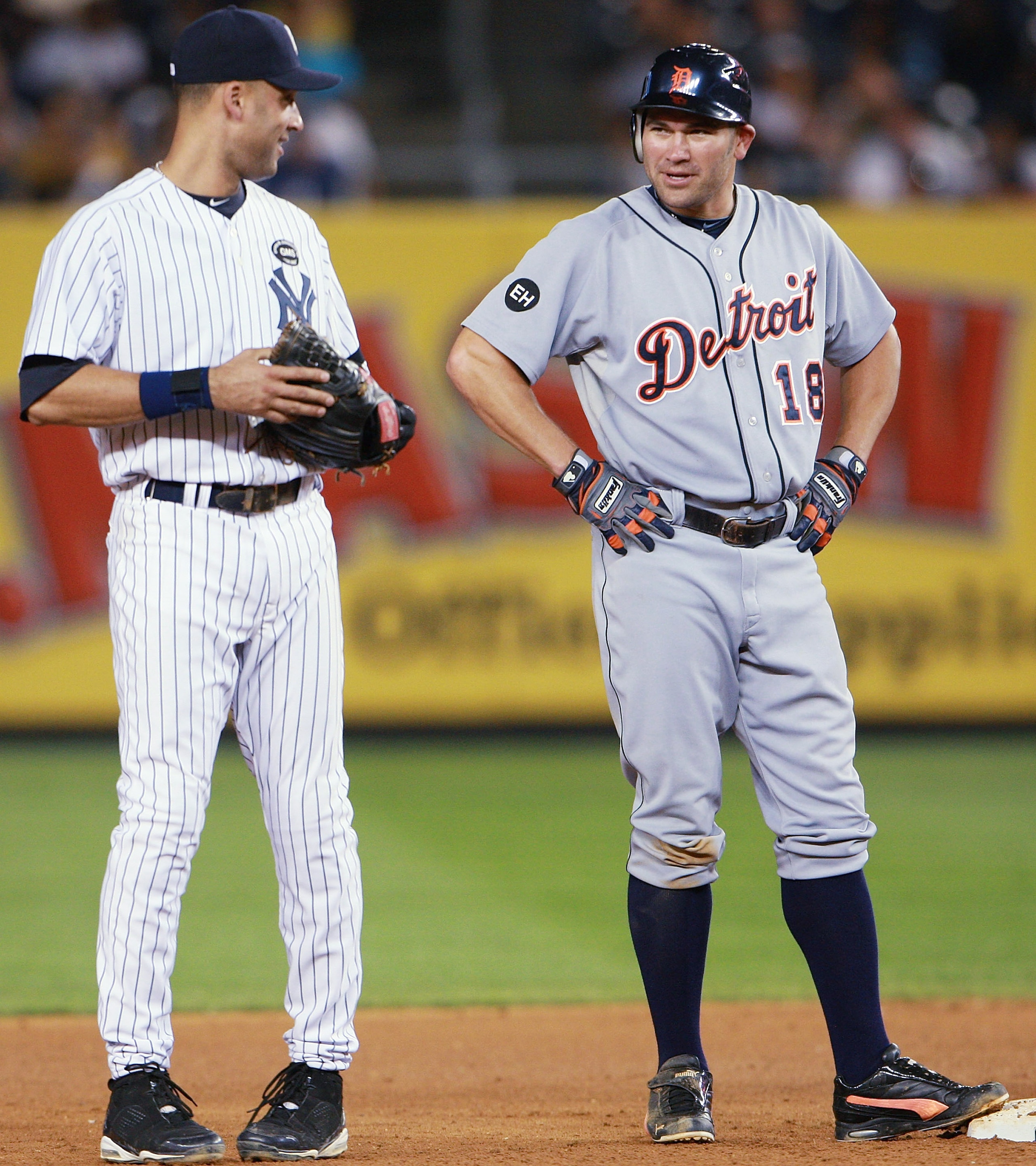 NEW YORK - AUGUST 18:  Johnny Damon #18 of the Detroit Tigers talks with Derek Jeter #2 of the New York Yankees during a game at Yankee Stadium on August 18, 2010 in the Bronx borough of New York City.  The Yankees won 9 - 5. (Photo by Andrew Burton/Getty