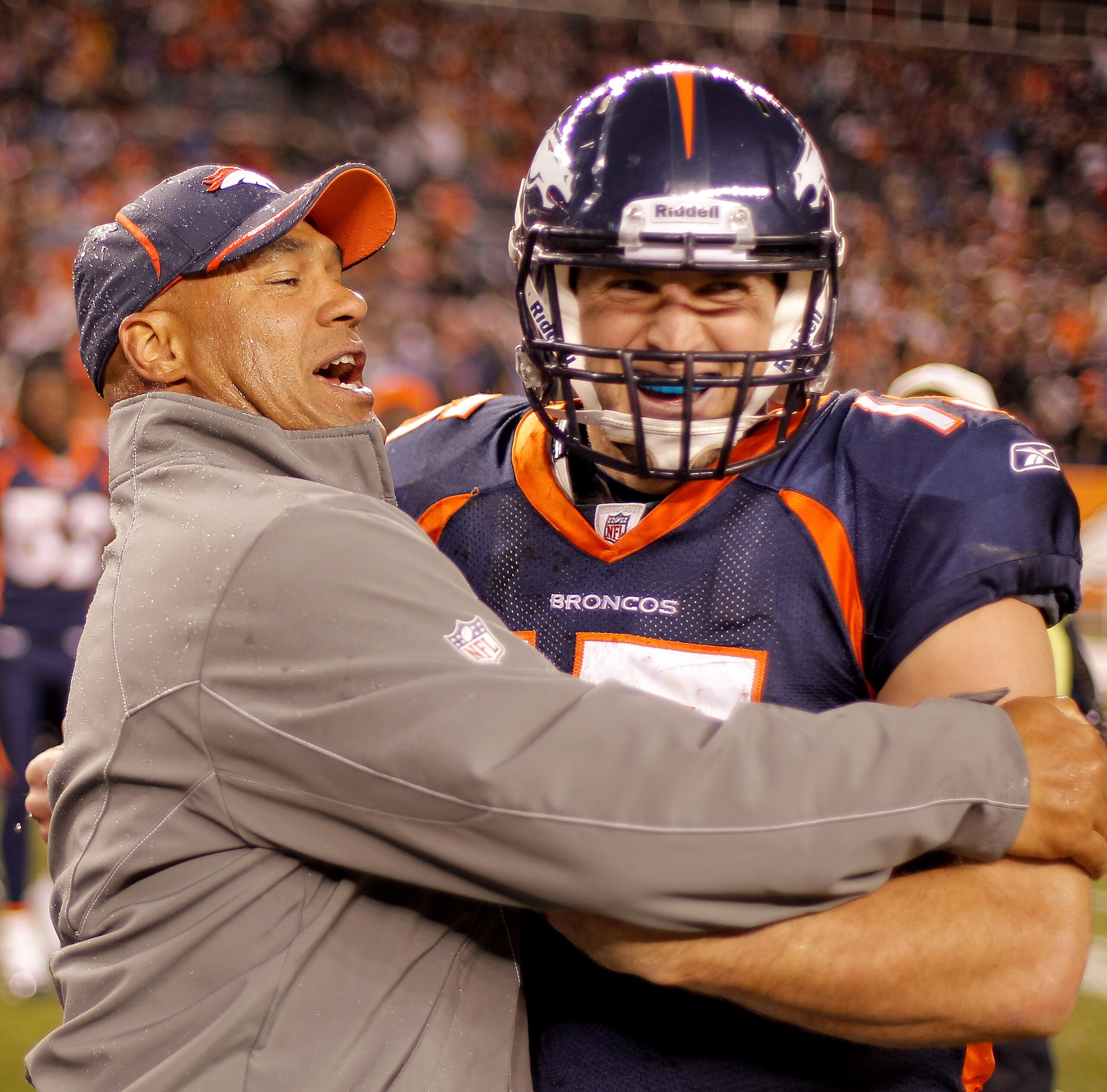 DENVER - DECEMBER 26: Head coach Eric Studesville of the Denver Broncos celebrates with quarterback Tim Tebow #15 following the Broncos 24-23 victory over the Houston Texans at INVESCO Field at Mile High on December 26, 2010 in Denver, Colorado. (Photo b DENVER - DECEMBER 26: Head coach Eric Studesville of the Denver Broncos celebrates with quarterback Tim Tebow #15 following the Broncos 24-23 victory over the Houston Texans at INVESCO Field at Mile High on December 26, 2010 in Denver, Colorado. (Photo b