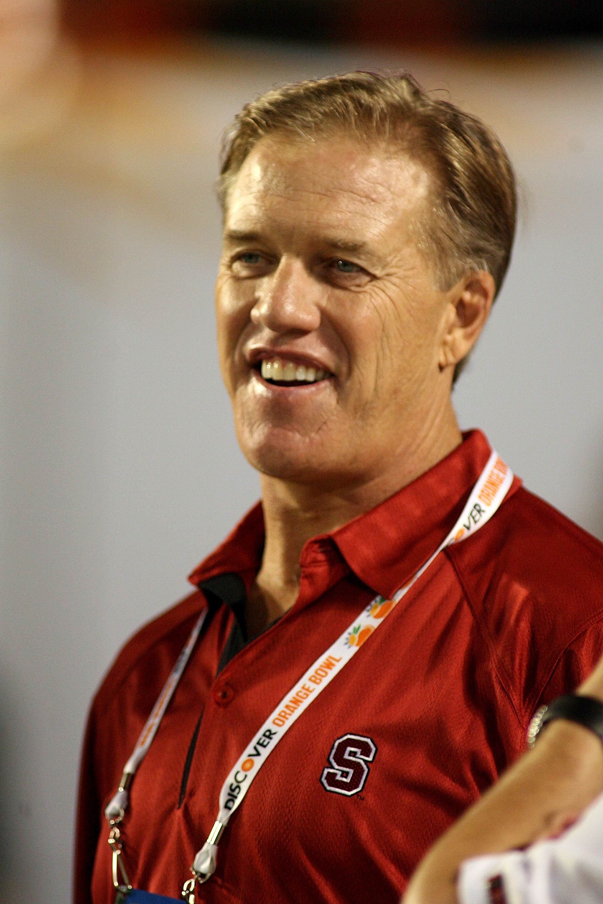 MIAMI, FL - JANUARY 03:  Stanford alum John Elway stands on the Stanford Cardinal sideline against the Virginai Tech Hokies during the 2011 Discover Orange Bowl at Sun Life Stadium on January 3, 2011 in Miami, Florida.  (Photo by Marc Serota/Getty Images)
