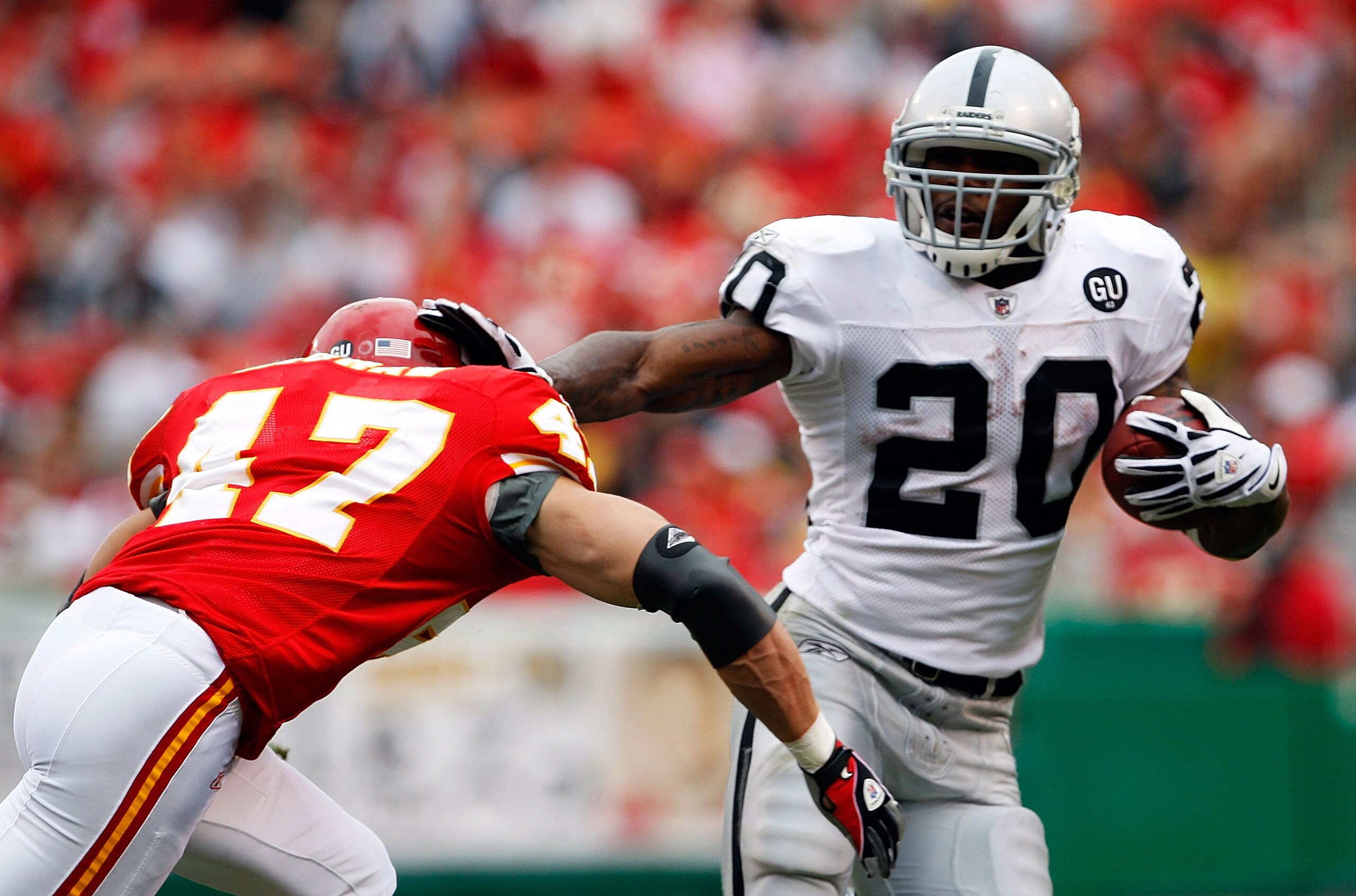 KANSAS CITY, MO - SEPTEMBER 14: Darren McFadden #20 of the Oakland Raiders carries the ball as Jon McGraw #47 of the Kansas City Chiefs defends during the first half fo the game on September 14, 2008 at Arrowhead Stadium in Kansas City, Missouri. (Photo KANSAS CITY, MO - SEPTEMBER 14: Darren McFadden #20 of the Oakland Raiders carries the ball as Jon McGraw #47 of the Kansas City Chiefs defends during the first half fo the game on September 14, 2008 at Arrowhead Stadium in Kansas City, Missouri. (Photo