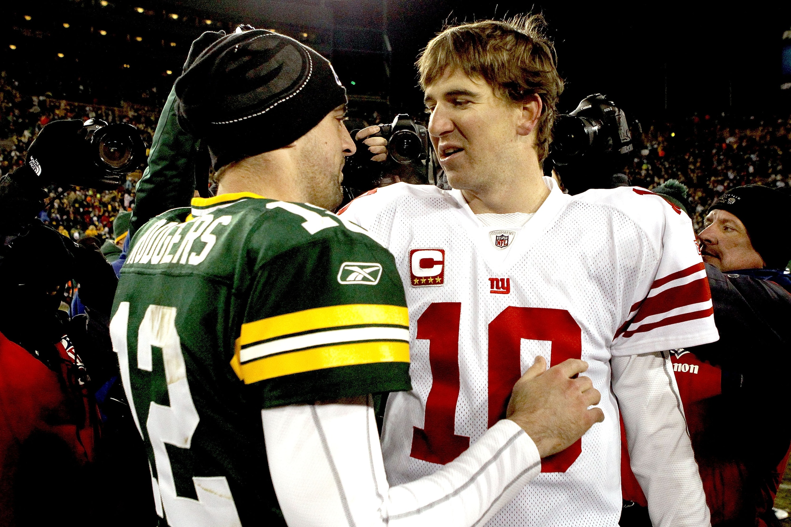 GREEN BAY, WI - DECEMBER 26: Aaron Rodgers #12 of the Green Bay Packers is congratulated by Eli Manning #10 of the New York Giants after their game at Lambeau Field on December 26, 2010 in Green Bay, Wisconsin. (Photo by Matthew Stockman/Getty Images) GREEN BAY, WI - DECEMBER 26: Aaron Rodgers #12 of the Green Bay Packers is congratulated by Eli Manning #10 of the New York Giants after their game at Lambeau Field on December 26, 2010 in Green Bay, Wisconsin. (Photo by Matthew Stockman/Getty Images)