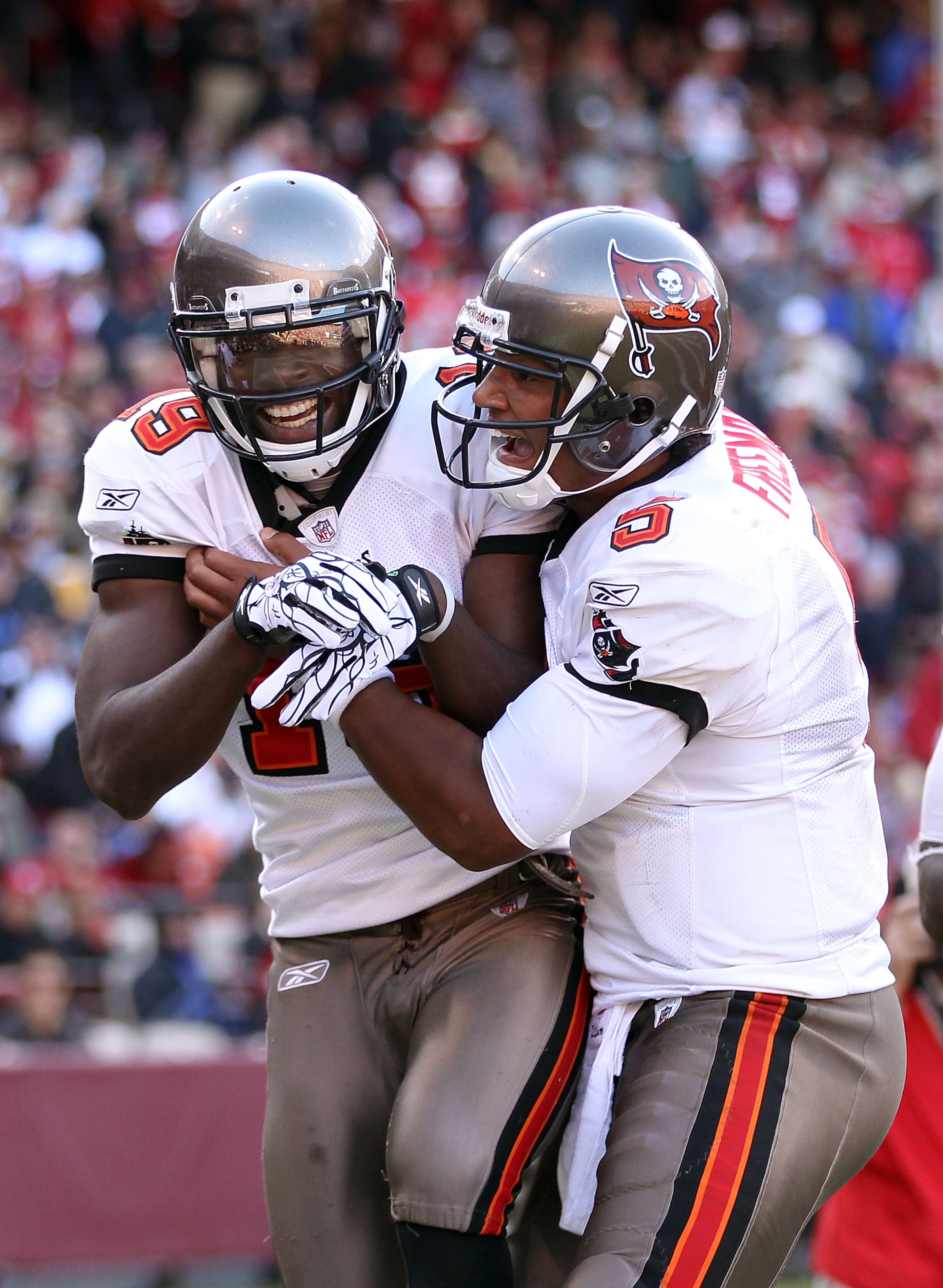 SAN FRANCISCO - NOVEMBER 21:  Mike Williams #19 of the Tampa Bay Buccaneers is congratulated by Josh Freeman #5 after he scored a touchdown against the San Francisco 49ers at Candlestick Park on November 21, 2010 in San Francisco, California.  (Photo by E