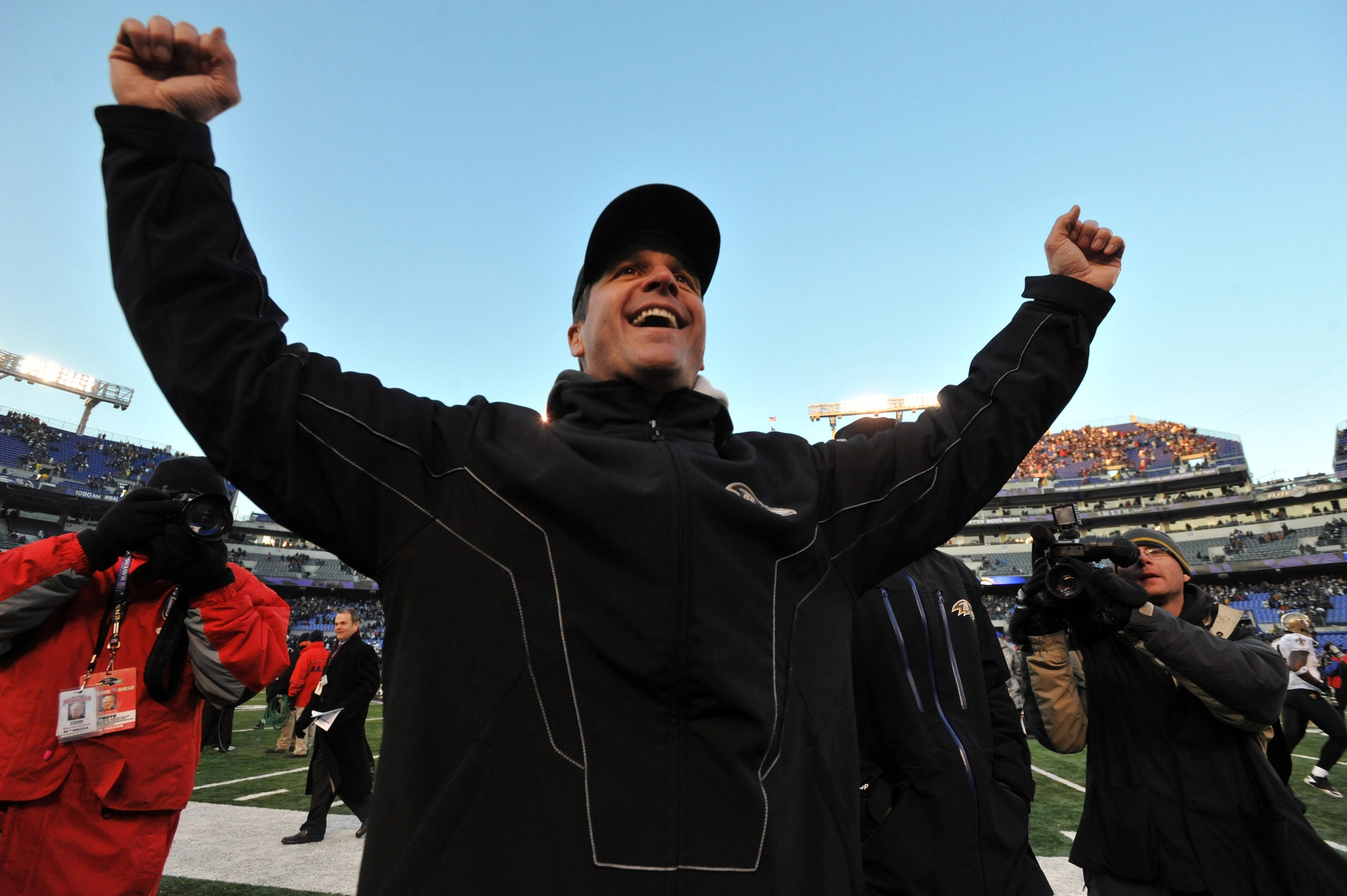 BALTIMORE, MD - DECEMBER 19: Head coach John Harbaugh of the Baltimore Ravens celebrates the Ravens victory as he walks off the field after the game against the New Orleans Saints at M&T Bank Stadium on December 19, 2010 in Baltimore, Maryland. The Rave BALTIMORE, MD - DECEMBER 19: Head coach John Harbaugh of the Baltimore Ravens celebrates the Ravens victory as he walks off the field after the game against the New Orleans Saints at M&T Bank Stadium on December 19, 2010 in Baltimore, Maryland. The Rave