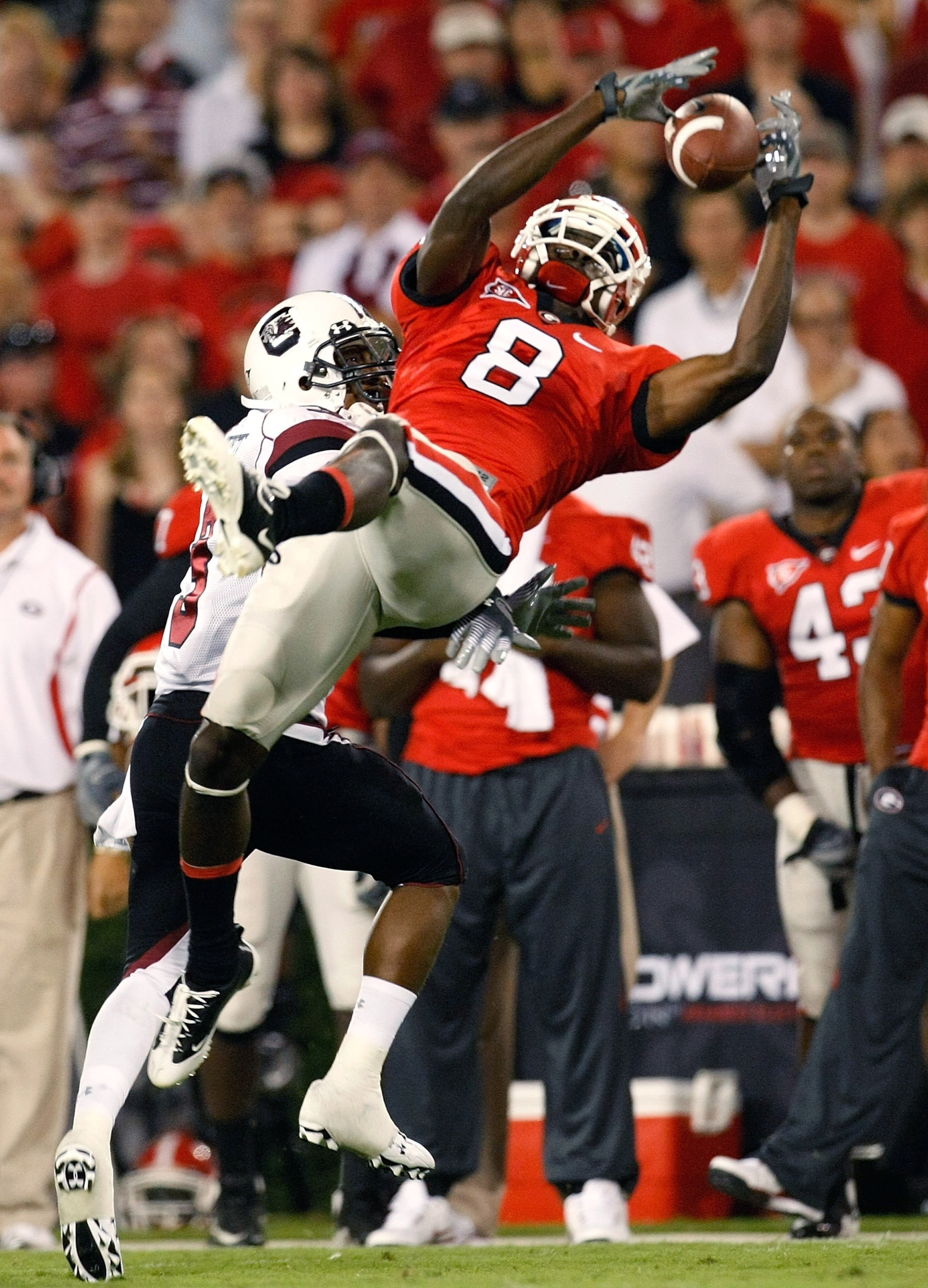 ATHENS, GA - SEPTEMBER 12:  A.J. Green #8 of the Georgia Bulldogs pulls in this reception against Akeem Auguste #3 of the South Carolina Gamecocks at Sanford Stadium on September 12, 2009 in Athens, Georgia.  (Photo by Kevin C. Cox/Getty Images)