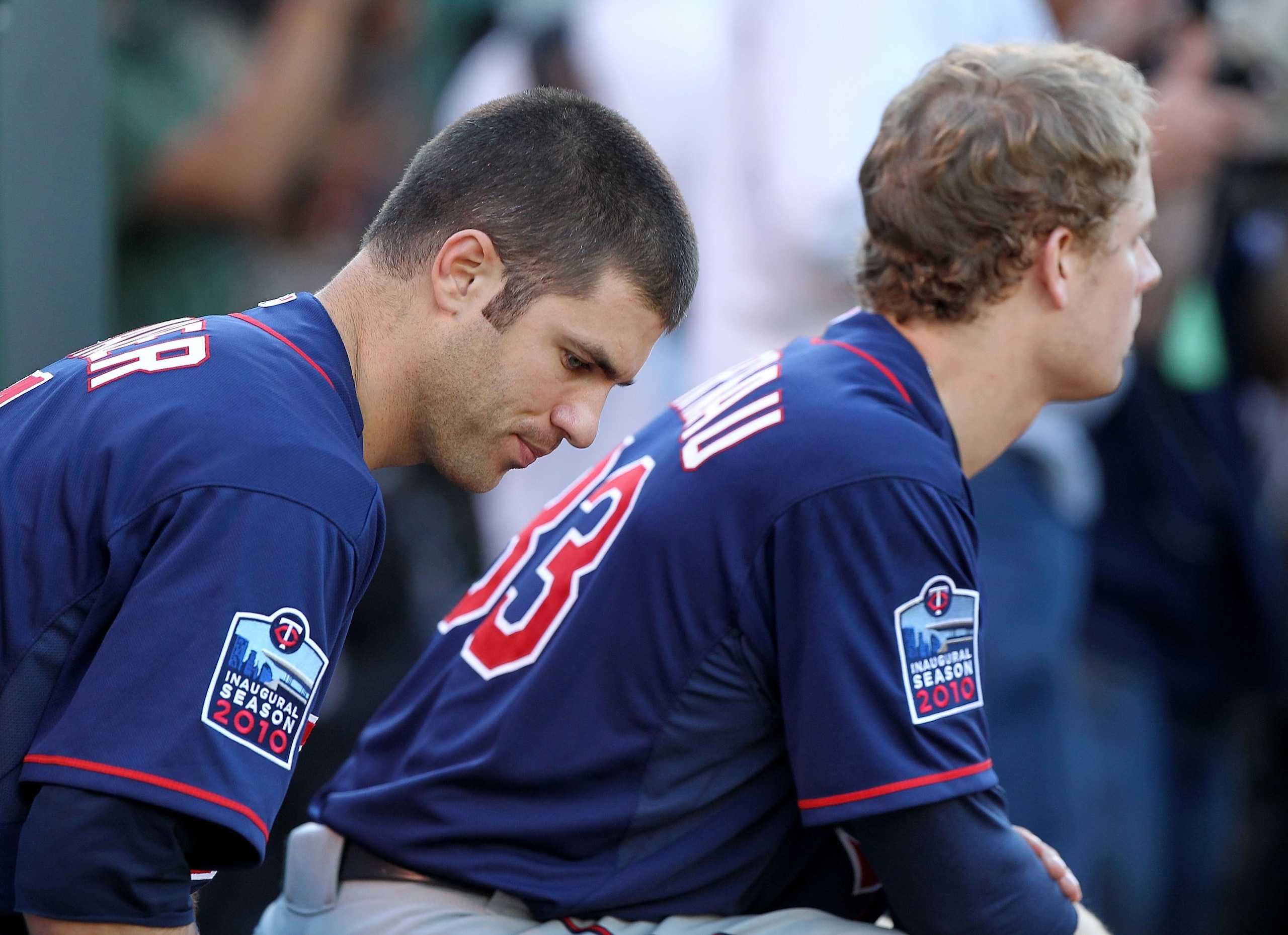 OAKLAND, CA - JUNE 04:  Justin Morneau #33 and Joe Mauer #7 of the Minnesota Twins look on against the Oakland Athletics during an MLB game at the Oakland-Alameda County Coliseum on June 4, 2010 in Oakland, California.  (Photo by Jed Jacobsohn/Getty Image