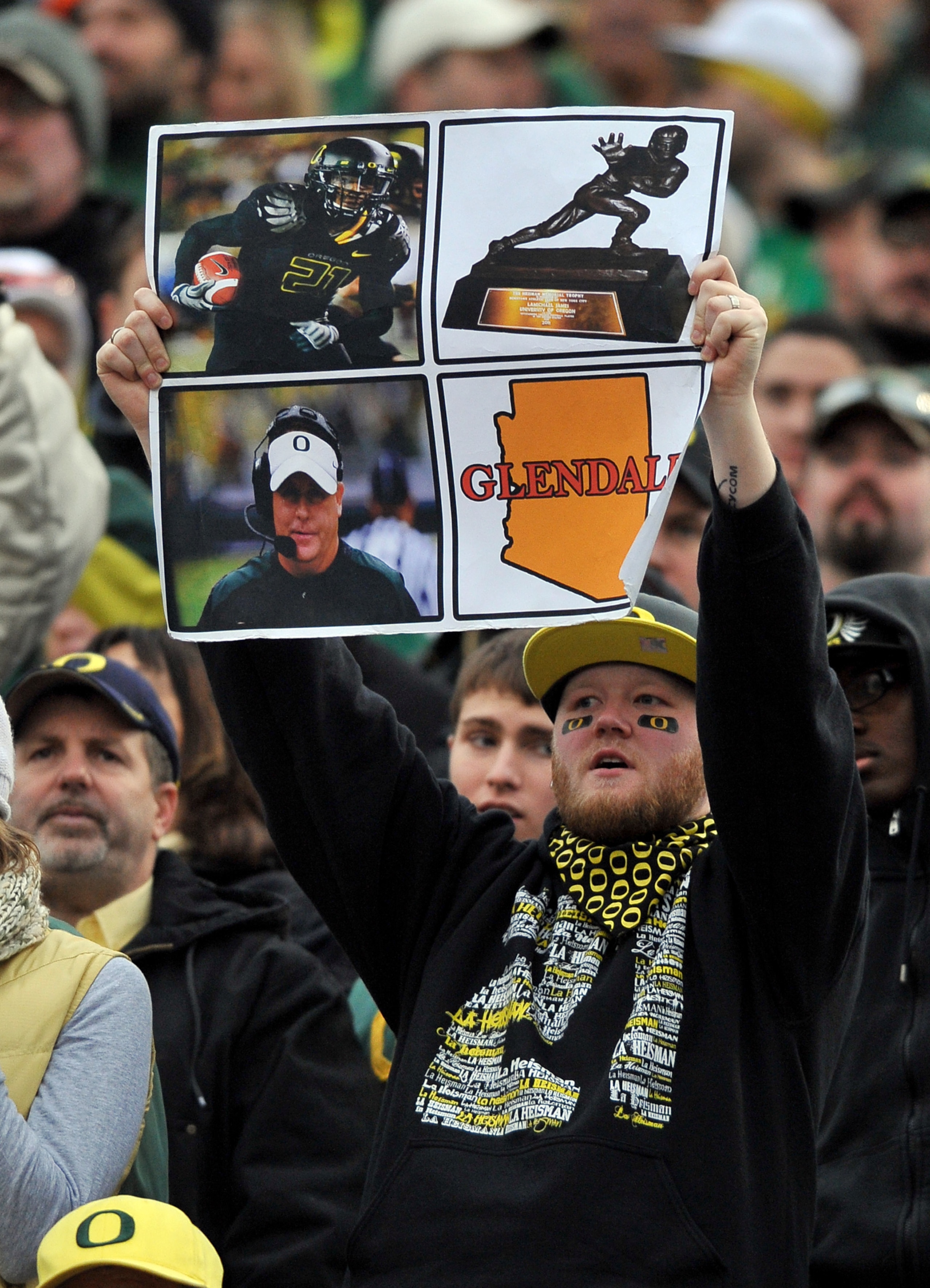 CORVALLIS, OR - DECEMBER 4: An Oregon Ducks fan holds up a sign in the fourth quarter of the game between the Oregon Ducks and the the Oregon State Beavers at Reser Stadium on December 4, 2010 in Corvallis, Oregon. The Ducks beat the Beavers 37-20 to go o