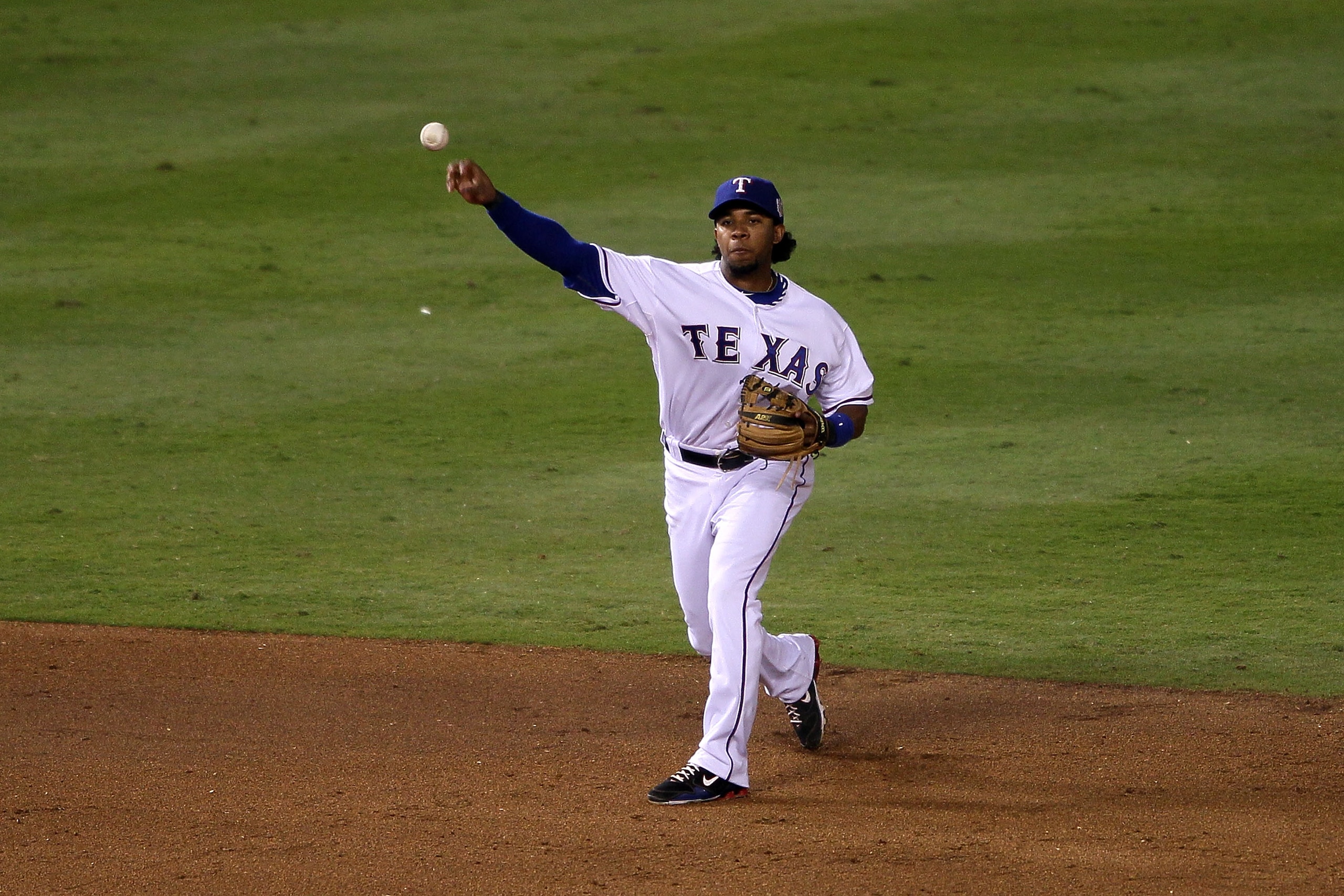 ARLINGTON, TX - NOVEMBER 01:  Elvis Andrus #1 of the Texas Rangers throws the ball to first base against the San Francisco Giants in Game Five of the 2010 MLB World Series at Rangers Ballpark in Arlington on November 1, 2010 in Arlington, Texas.  (Photo b