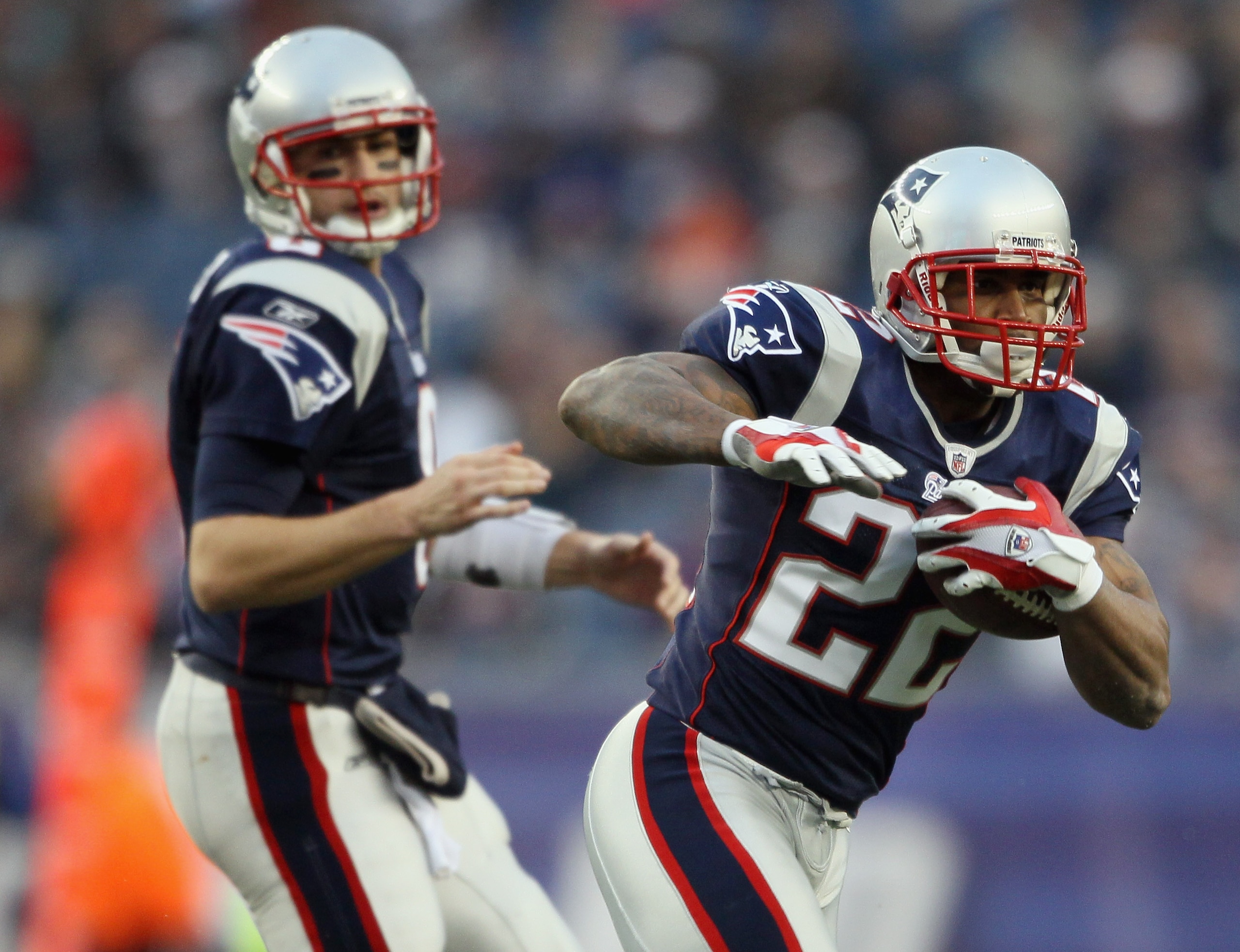 FOXBORO, MA - JANUARY 02:  Thomas Clayton #22 of the New England Patriots takes the handoff from Brian Hoyer #8 in the third quarter against the Miami Dolphins on January 2, 2011 at Gillette Stadium in Foxboro, Massachusetts.  (Photo by Elsa/Getty Images)