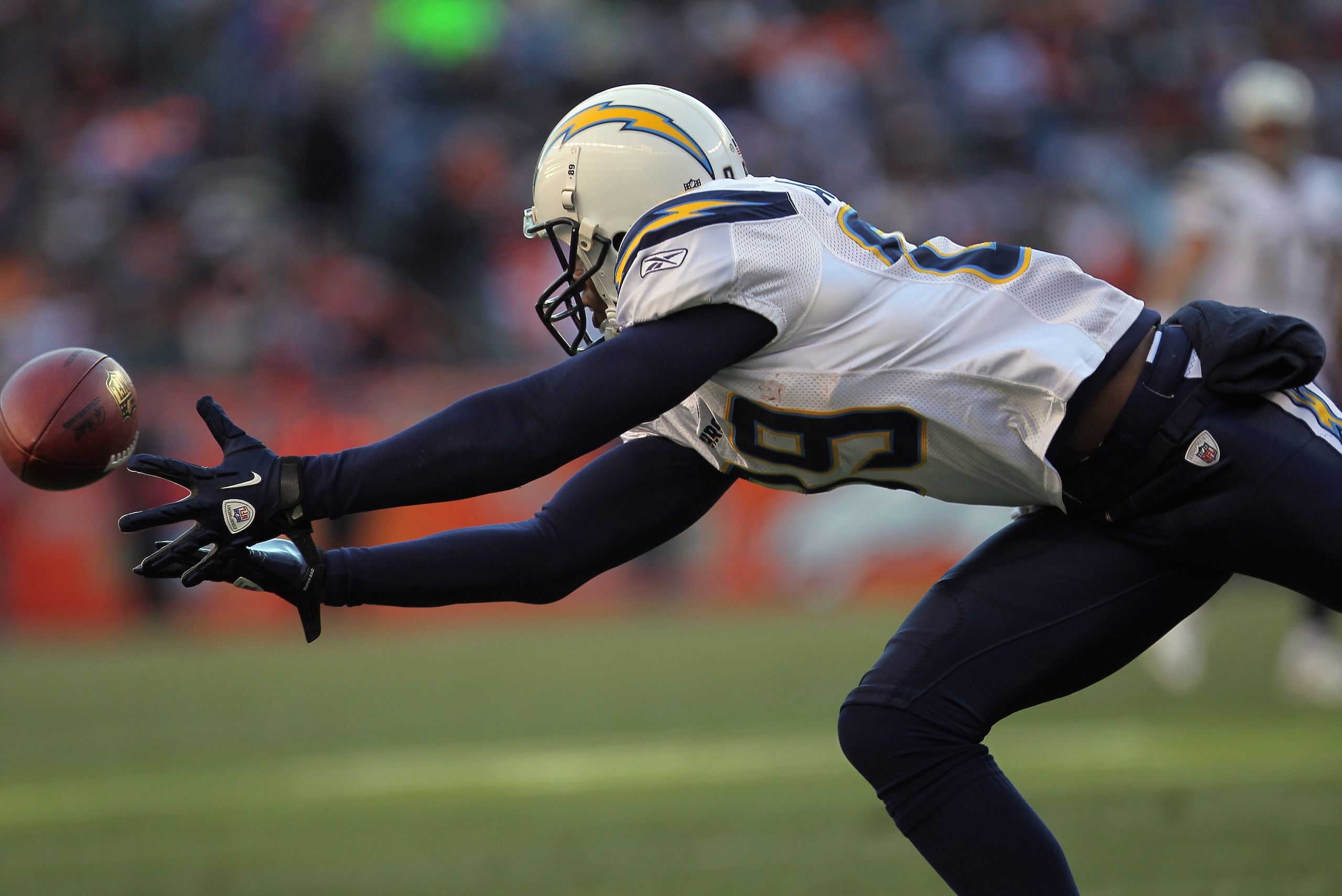 DENVER - JANUARY 02:  Wide receiver Seyi Ajirotutu #89 of the San Diego Chargers dives for a pass  against the Denver Broncos at INVESCO Field at Mile High on January 2, 2011 in Denver, Colorado. The Chargers defeated the Broncos 33-28.  (Photo by Doug Pe