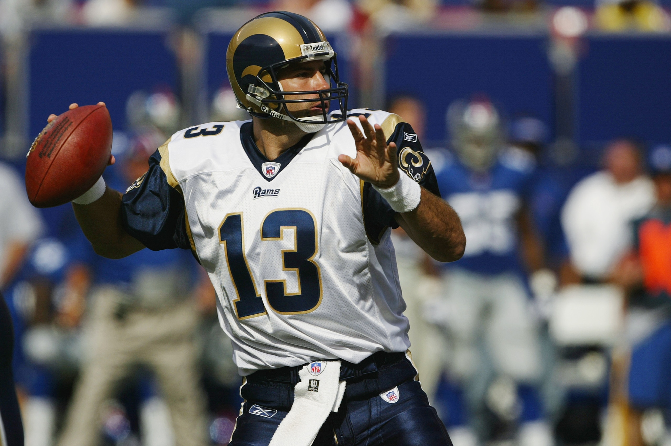 EAST RUTHERFORD, NJ - SEPTEMBER 7: Quarterback Kurt Warner #13 of the St. Louis Rams throws a pass against the New York Giants during the game at the Giants Stadium on September 7, 2003 in East Rutherford, New Jersey. The Giants defeated the Rams 23-13. EAST RUTHERFORD, NJ - SEPTEMBER 7: Quarterback Kurt Warner #13 of the St. Louis Rams throws a pass against the New York Giants during the game at the Giants Stadium on September 7, 2003 in East Rutherford, New Jersey. The Giants defeated the Rams 23-13.