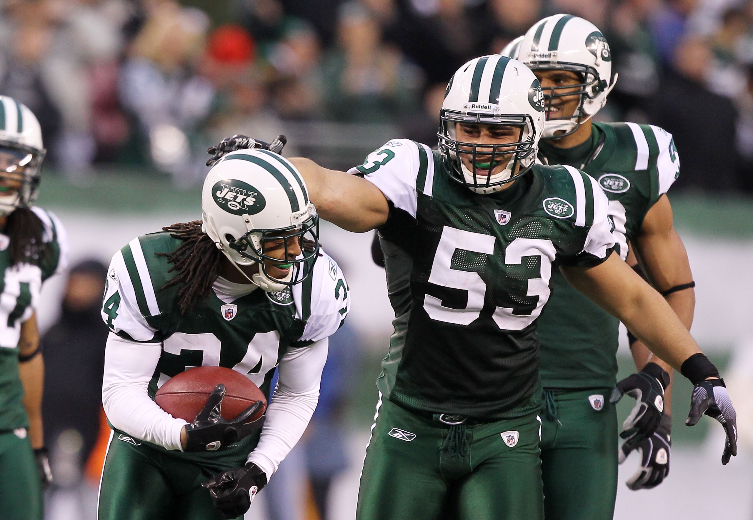 EAST RUTHERFORD, NJ - JANUARY 02:  Marquice Cole #34 celebrates with Josh Mauga #53 of the New York Jets during their game against the Buffalo Bills at New Meadowlands Stadium on January 2, 2011 in East Rutherford, New Jersey.  (Photo by Al Bello/Getty Im