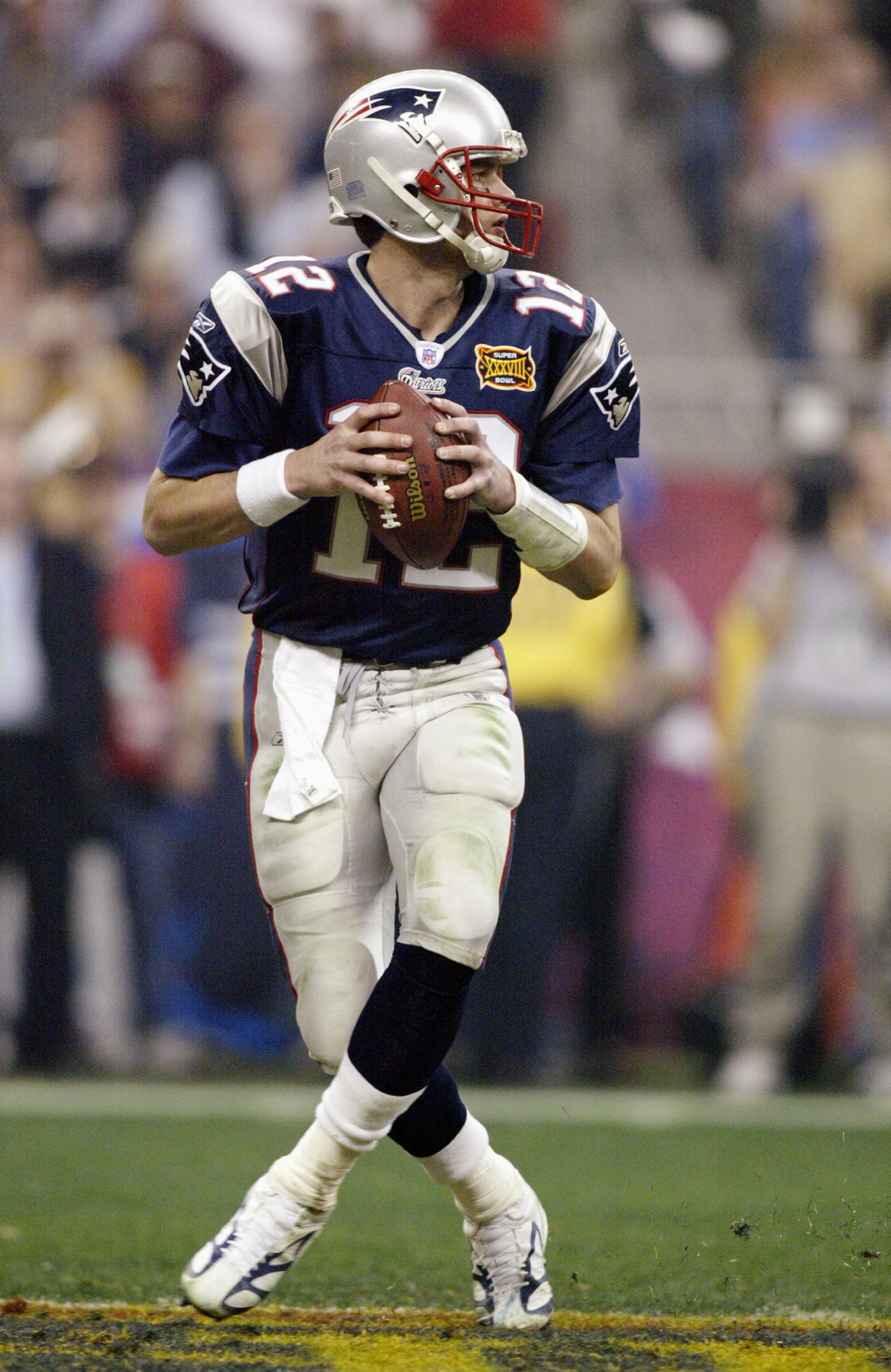 HOUSTON, TX - FEBRUARY 1: Quarterback Tom Brady #12 of the New England Patriots drops back to pass against the Carolina Panthers during Super Bowl XXXVIII at Reliant Stadium on February 1, 2004 in Houston, Texas. The Patriots won 332-29 to claim their se HOUSTON, TX - FEBRUARY 1: Quarterback Tom Brady #12 of the New England Patriots drops back to pass against the Carolina Panthers during Super Bowl XXXVIII at Reliant Stadium on February 1, 2004 in Houston, Texas. The Patriots won 332-29 to claim their se