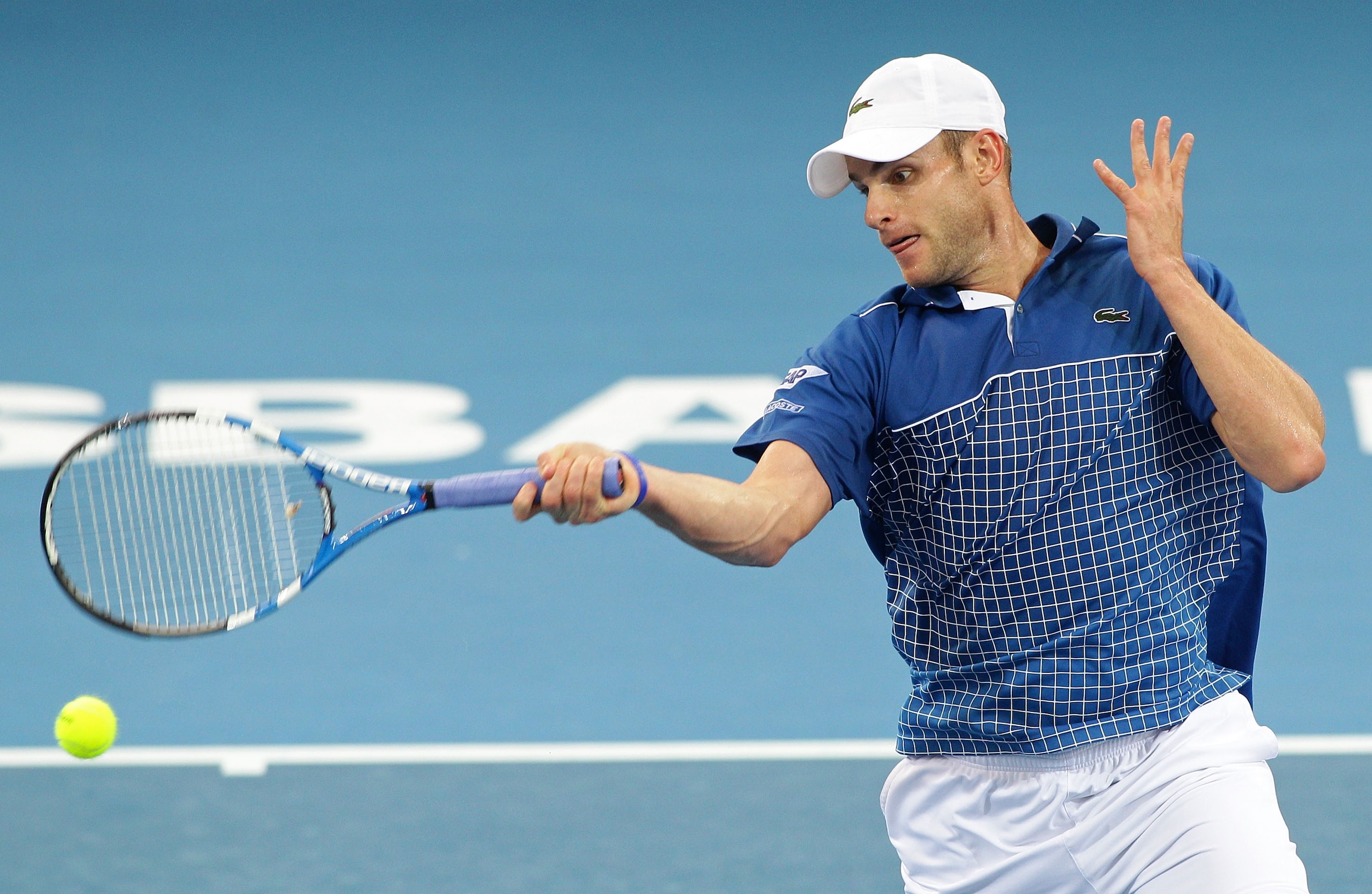 BRISBANE, AUSTRALIA - JANUARY 05:  Andy Roddick of the USA plays a forehand during his second round match against Alexandr Dolgopolov  of the Ukraine during day four of the Brisbane International at Queensland Tennis Centre on January 5, 2011 in Brisbane,
