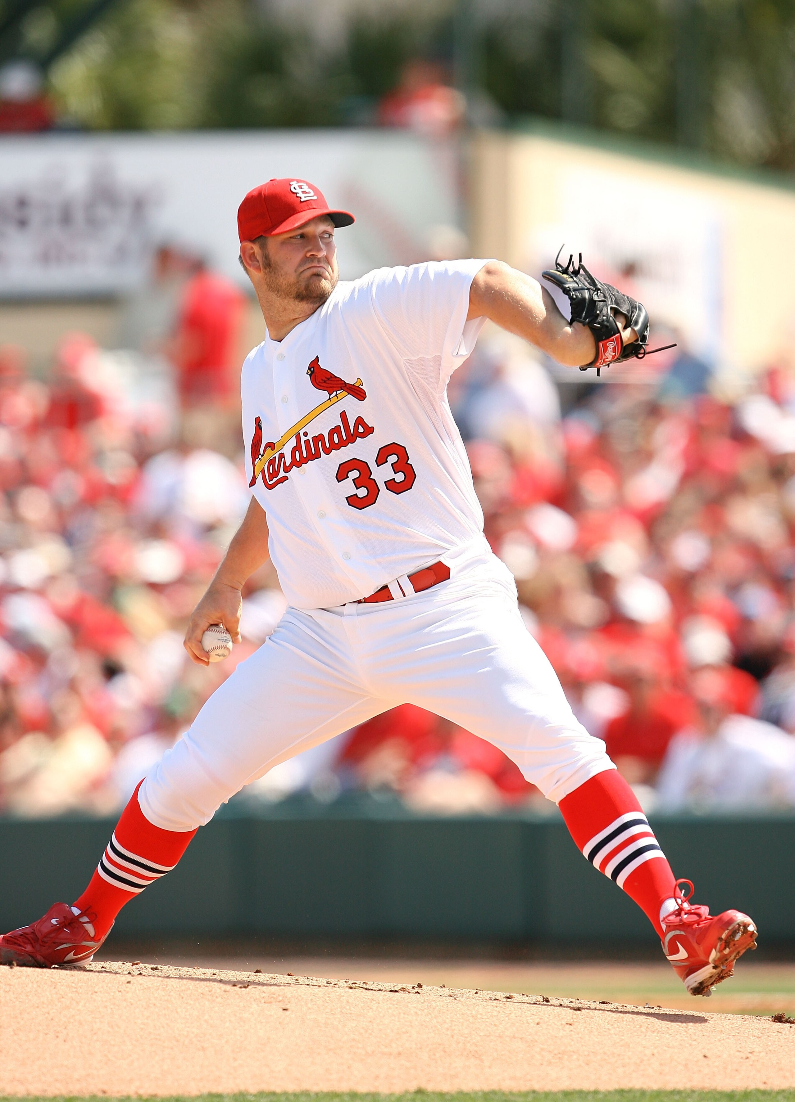 JUPITER, FL - MARCH 10:  Starting pitcher Brad Penny #33 of the St Louis Cardinals pitches against the Washington Nationals at Roger Dean Stadium on March 10, 2010 in Jupiter, Florida.  (Photo by Doug Benc/Getty Images)