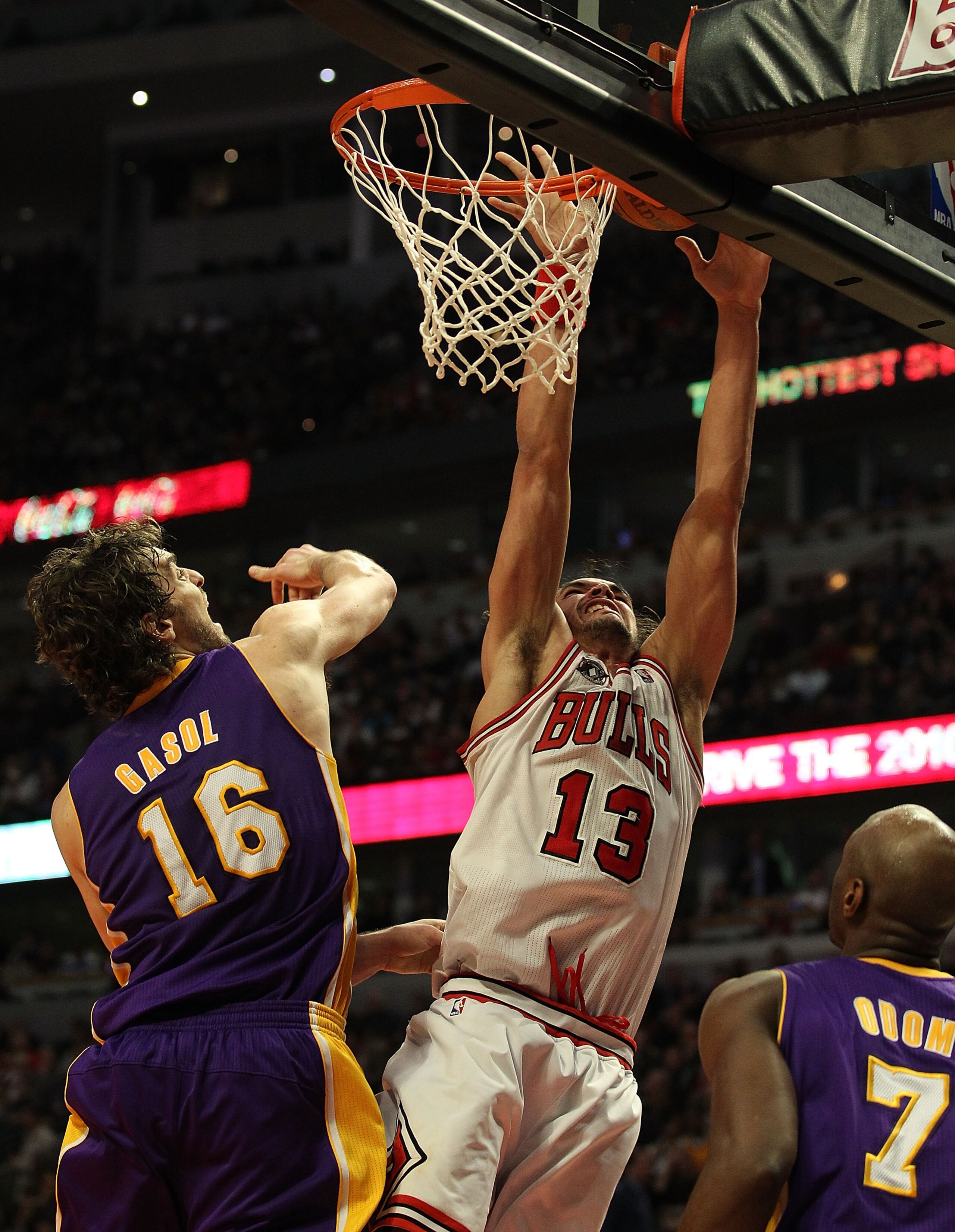 CHICAGO, IL - DECEMBER 10: Joakim Noah #13 of the Chicago Bulls puts up a shot over Pau Gasol #16 and Lamar Odom #7 of the Los Angeles Lakers at the United Center on December 10, 2010 in Chicago, Illinois. The Bulls defeated the Lakers 88-84. NOTE TO USER