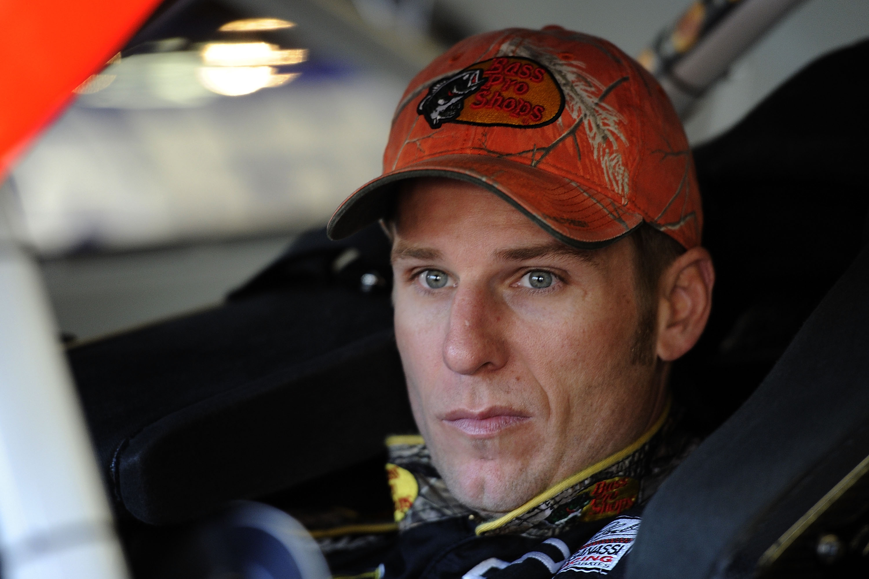 FORT WORTH, TX - NOVEMBER 06:  Jamie McMurray, driver of the #1 Bass Pro Shops/Arctic Cat Chevrolet, sits in his car in the garage area during practice for the NASCAR Sprint Cup Series AAA Texas 500 at Texas Motor Speedway on November 6, 2010 in Fort Wort