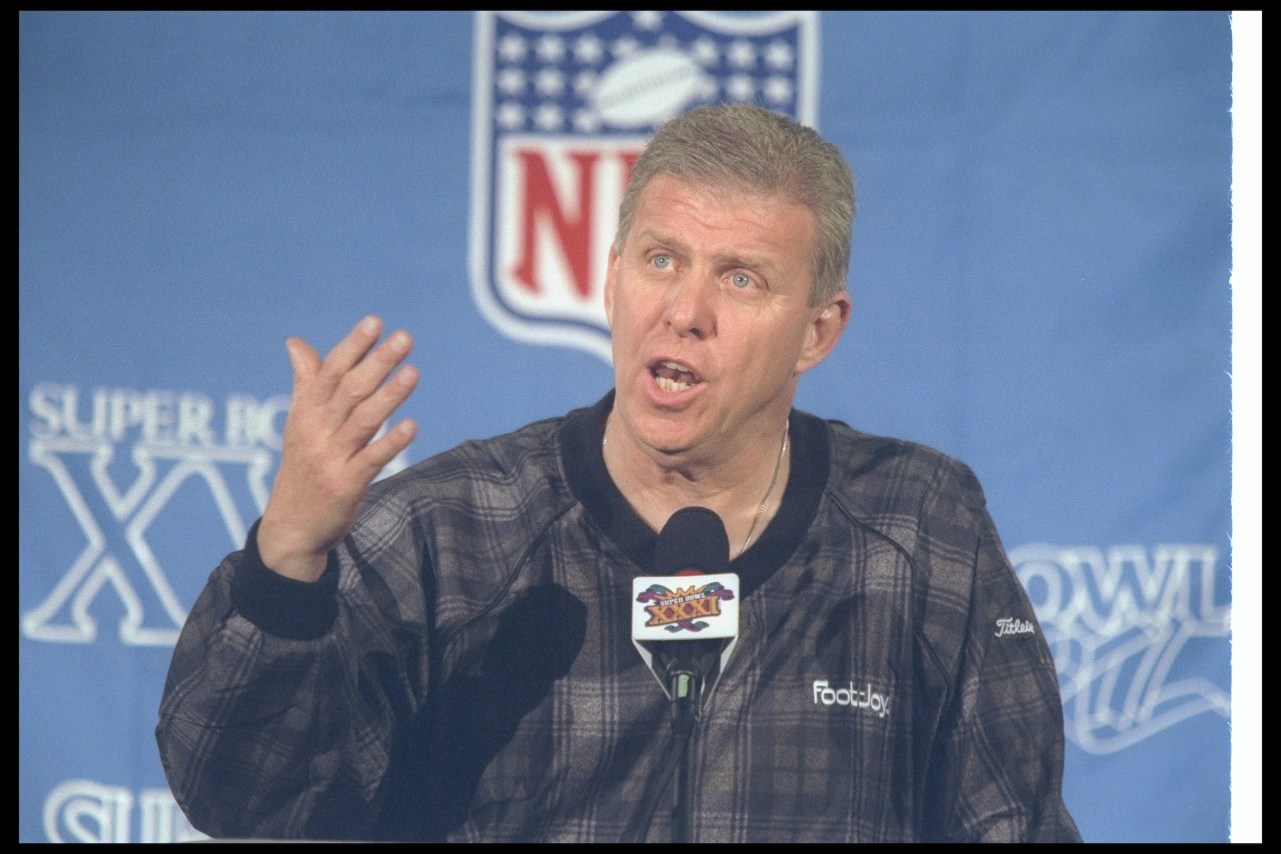23 Jan 1997:  New England Patriots head coach Bill Parcells talks at a press conference at the New Orleans Mariott Hotel before Super Bowl XXXI against the Green Bay Packers at the Superdome in New Orleans, Louisiana.  The Packers won the game, 35-21. Man