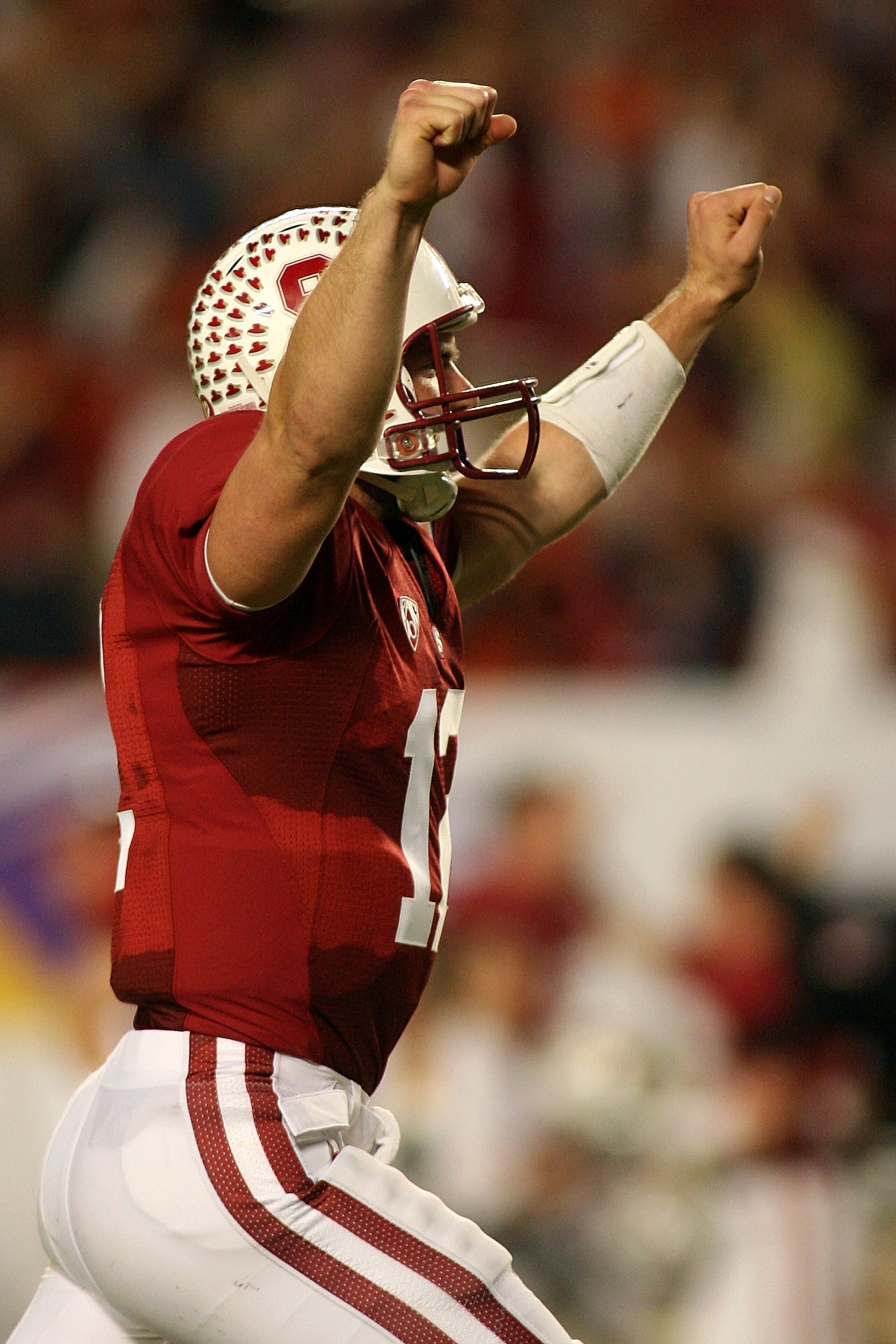 MIAMI, FL - JANUARY 03:  Andrew Luck #12 of the Stanford Cardinal celebrates after Jeremy Stewart scored a 60-yard rushing touchdown in the first quarter against the Virginai Tech Hokies during the 2011 Discover Orange Bowl at Sun Life Stadium on January