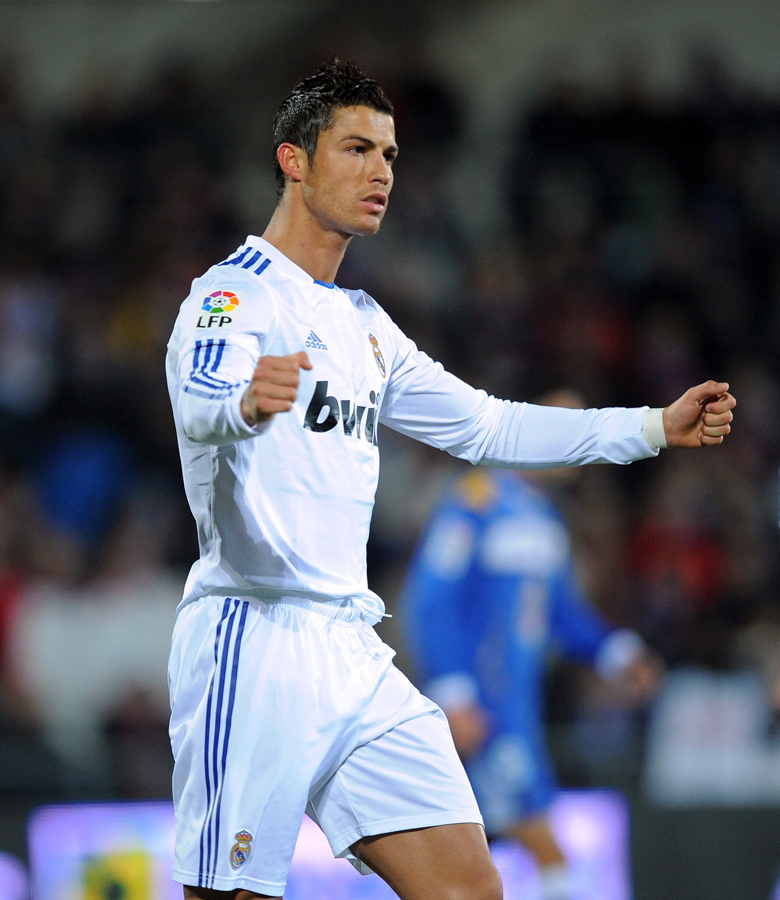 GETAFE, SPAIN - JANUARY 03:  Cristiano Ronaldo of Real Madrid celebrates after scoring Real's first goal from the penalty spot during the La Liga match between Getafe and Real Madrid at Coliseum Alfonso Perez stadium on January 3, 2011 in Getafe, Spain.
