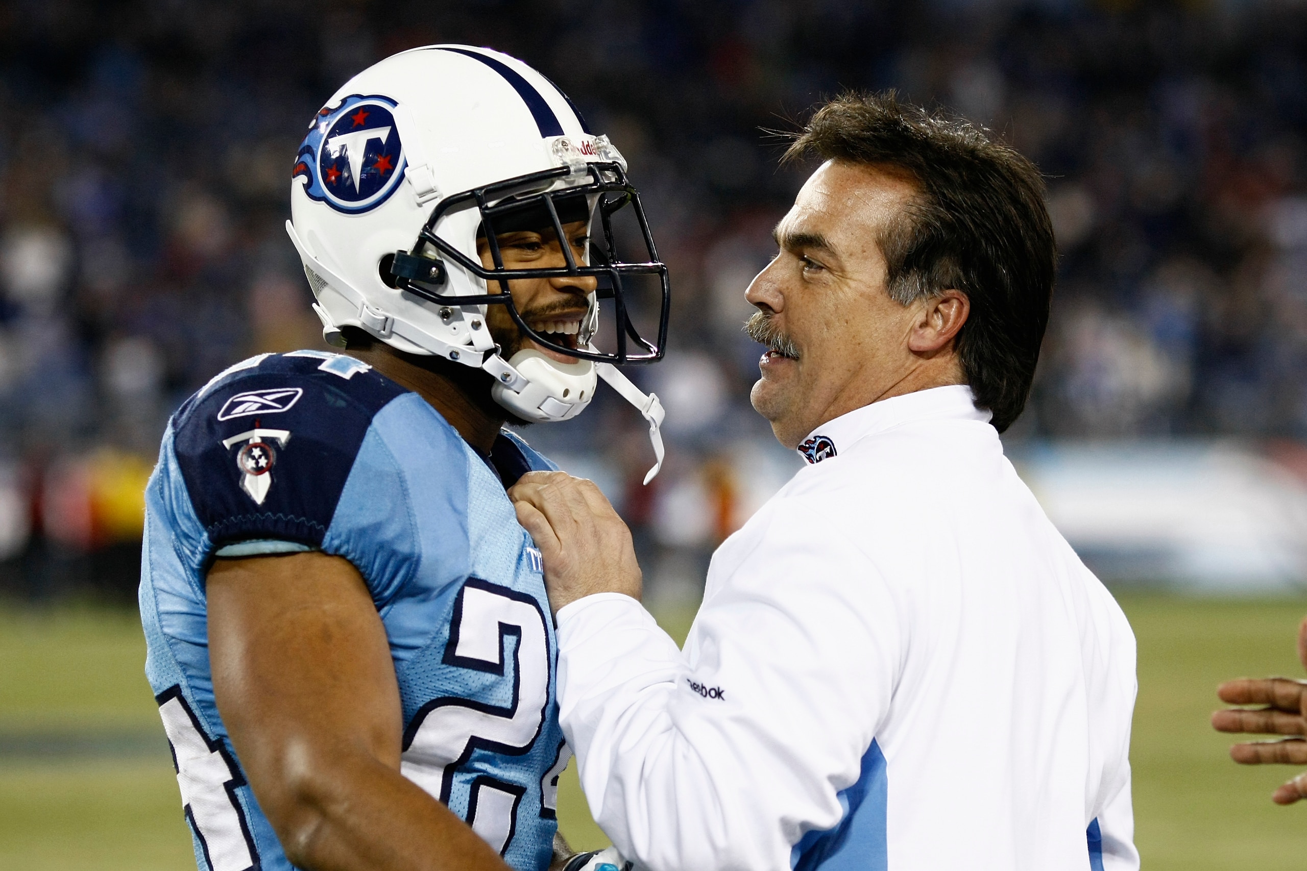 NASHVILLE, TN - DECEMBER 13: Head coach Jeff Fisher of the Tennessee Titans congratulates Chris Hope #24 after a defensive stop against the St. Louis Rams at LP Field on December 13, 2009 in Nashville, Tennessee. The Titans defeated the Rams 47-7. (Photo