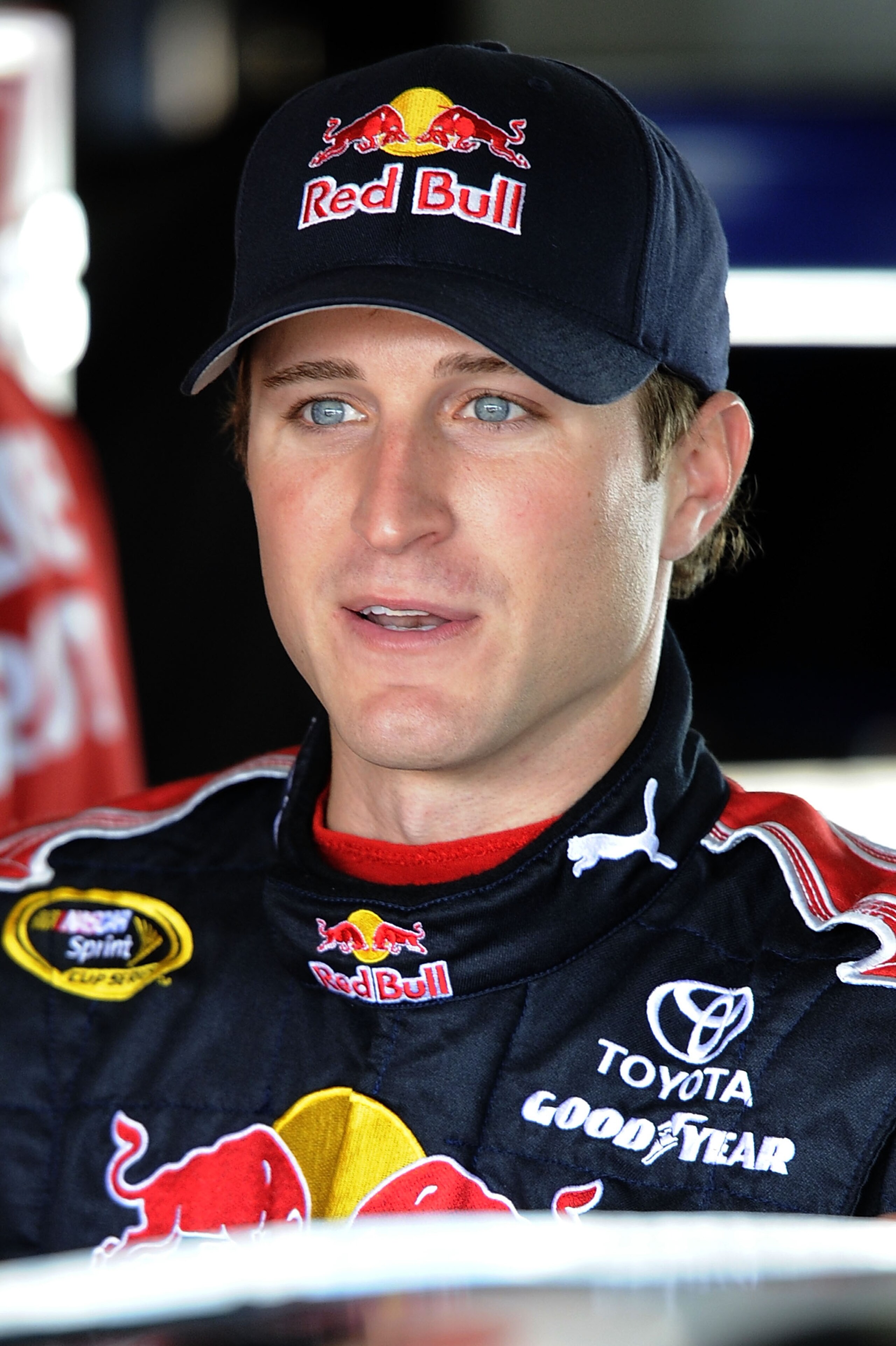 HOMESTEAD, FL - NOVEMBER 20:  Kasey Kahne, driver of the #83 Red Bull Toyota, stands in the garage during practice for the NASCAR Sprint Cup Series Ford 400 at Homestead-Miami Speedway on November 20, 2010 in Homestead, Florida.  (Photo by John Harrelson/