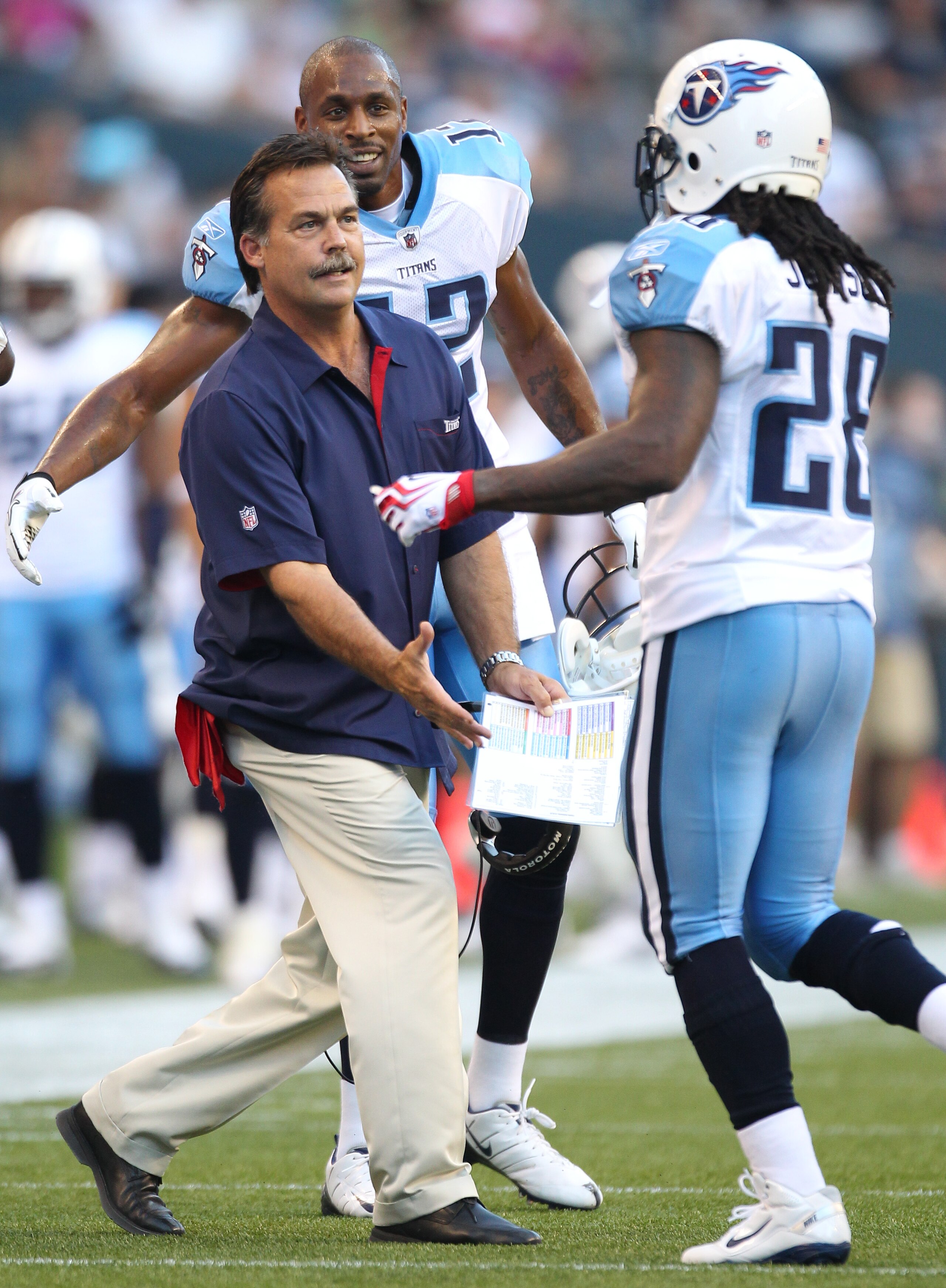 SEATTLE - AUGUST 14:  Head coach Jeff Fisher of the Tennessee Titans congratulates Chris Johnson #28 after scoring a touchdown during the preseason game against the Seattle Seahawks at Qwest Field on August 14, 2010 in Seattle, Washington. (Photo by Otto
