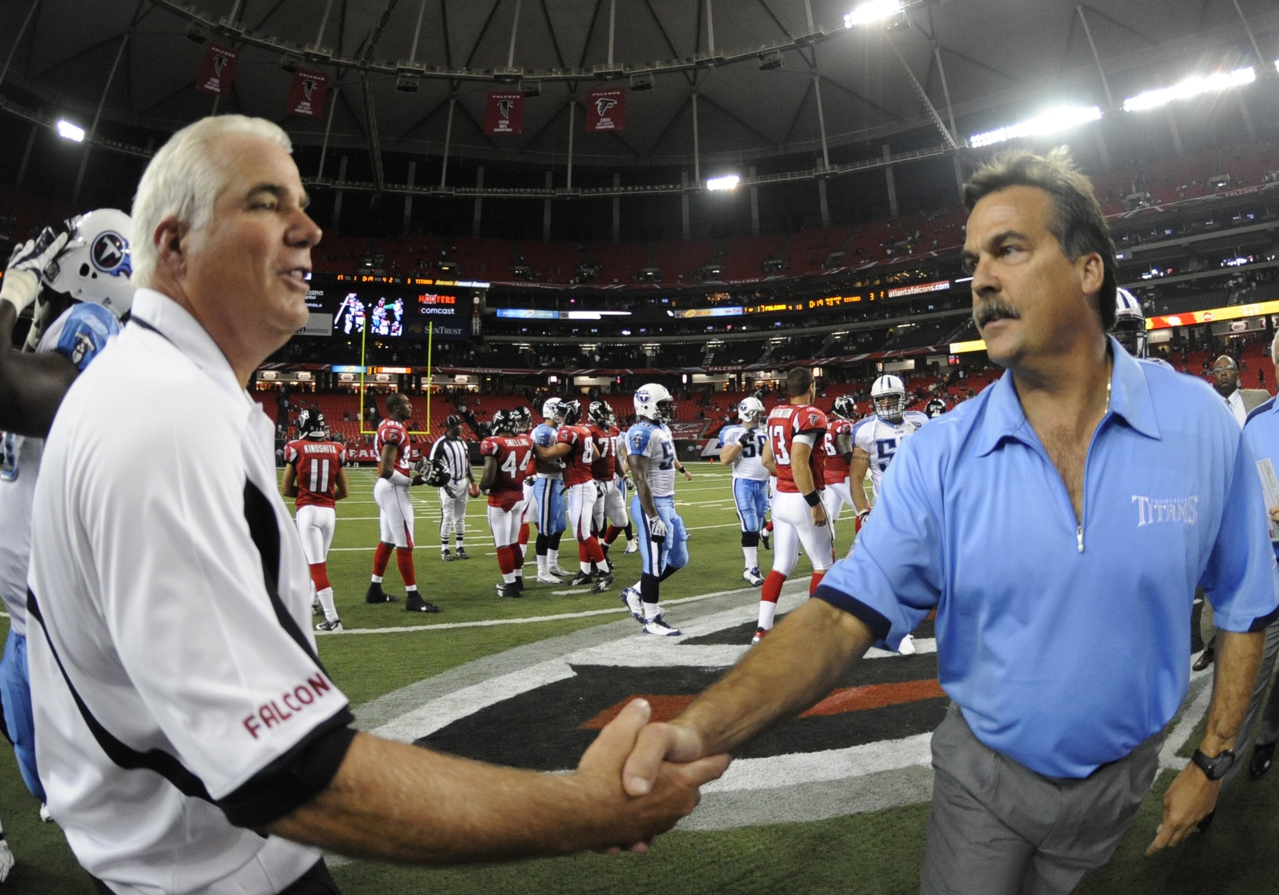 ATLANTA - AUGUST 22: Coach Jeff Fisher (right) of the Tennessee Titans and coach Mike Smith of the Atlanta Falcons shake hands after play at the Georgia Dome on August 22, 2008 in Atlanta, Georgia.  (Photo by Al Messerschmidt/Getty Images)