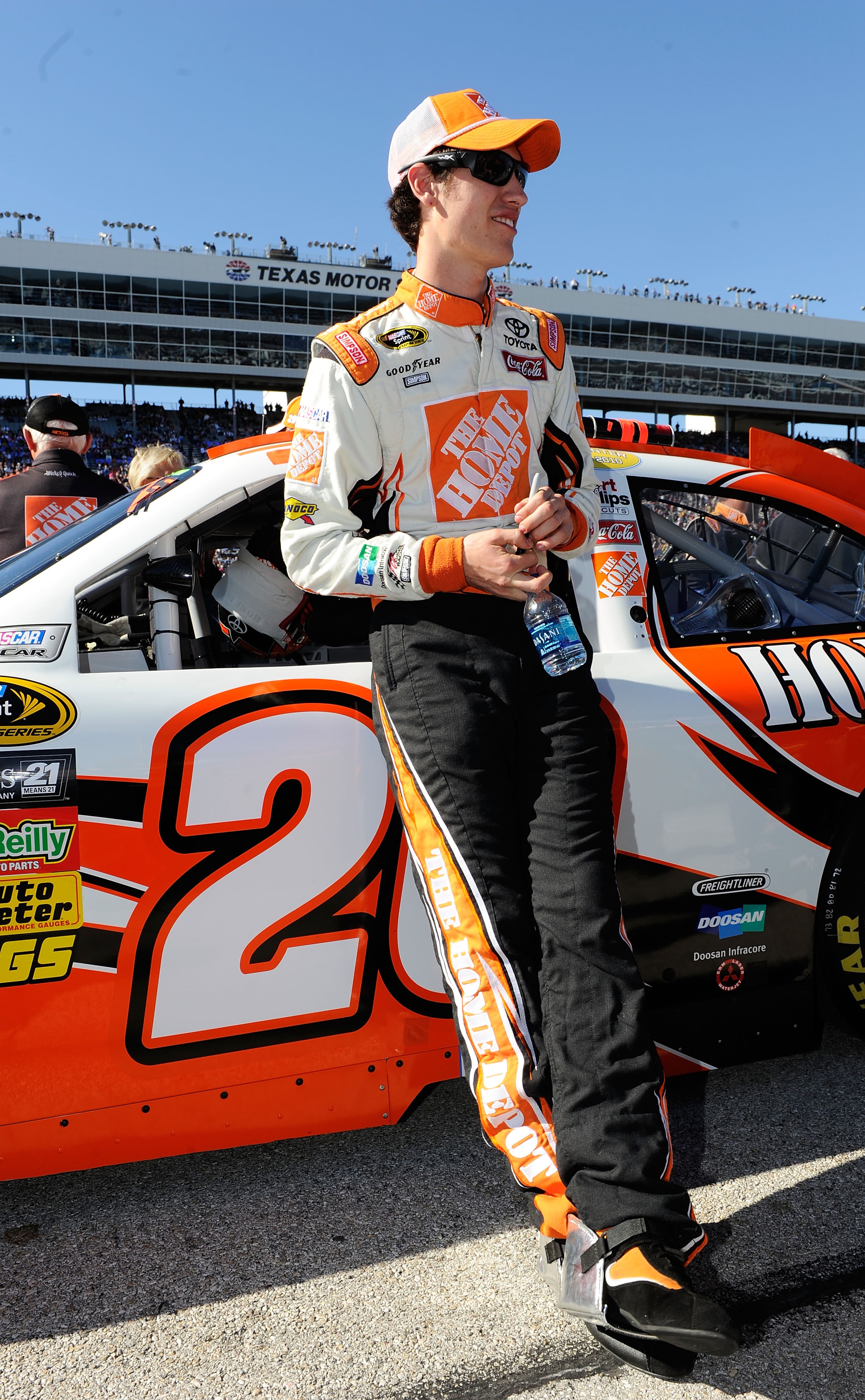 FORT WORTH, TX - NOVEMBER 07:  Joey Logano, driver of the #20 Home Depot Toyota, stands on the grid prior to the NASCAR Sprint Cup Series AAA Texas 500 at Texas Motor Speedway on November 7, 2010 in Fort Worth, Texas.  (Photo by John Harrelson/Getty Image