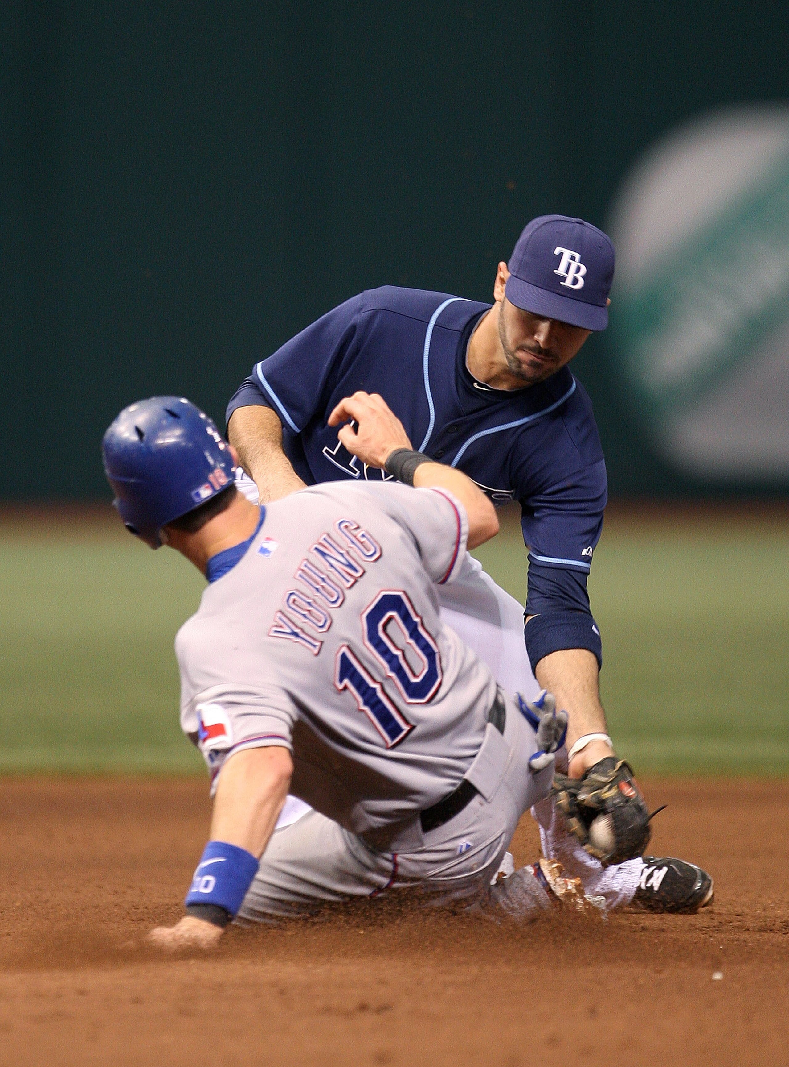 ST PETERSBURG, FL - OCTOBER 07: Jason Bartlett #8 of the Tampa Bay Rays tags out Michael Young #10 after trying to reach second on a fly ball during Game 2 of the ALDS against the Texas Rangers at Tropicana Field on October 7, 2010 in St. Petersburg, Flor ST PETERSBURG, FL - OCTOBER 07: Jason Bartlett #8 of the Tampa Bay Rays tags out Michael Young #10 after trying to reach second on a fly ball during Game 2 of the ALDS against the Texas Rangers at Tropicana Field on October 7, 2010 in St. Petersburg, Flor