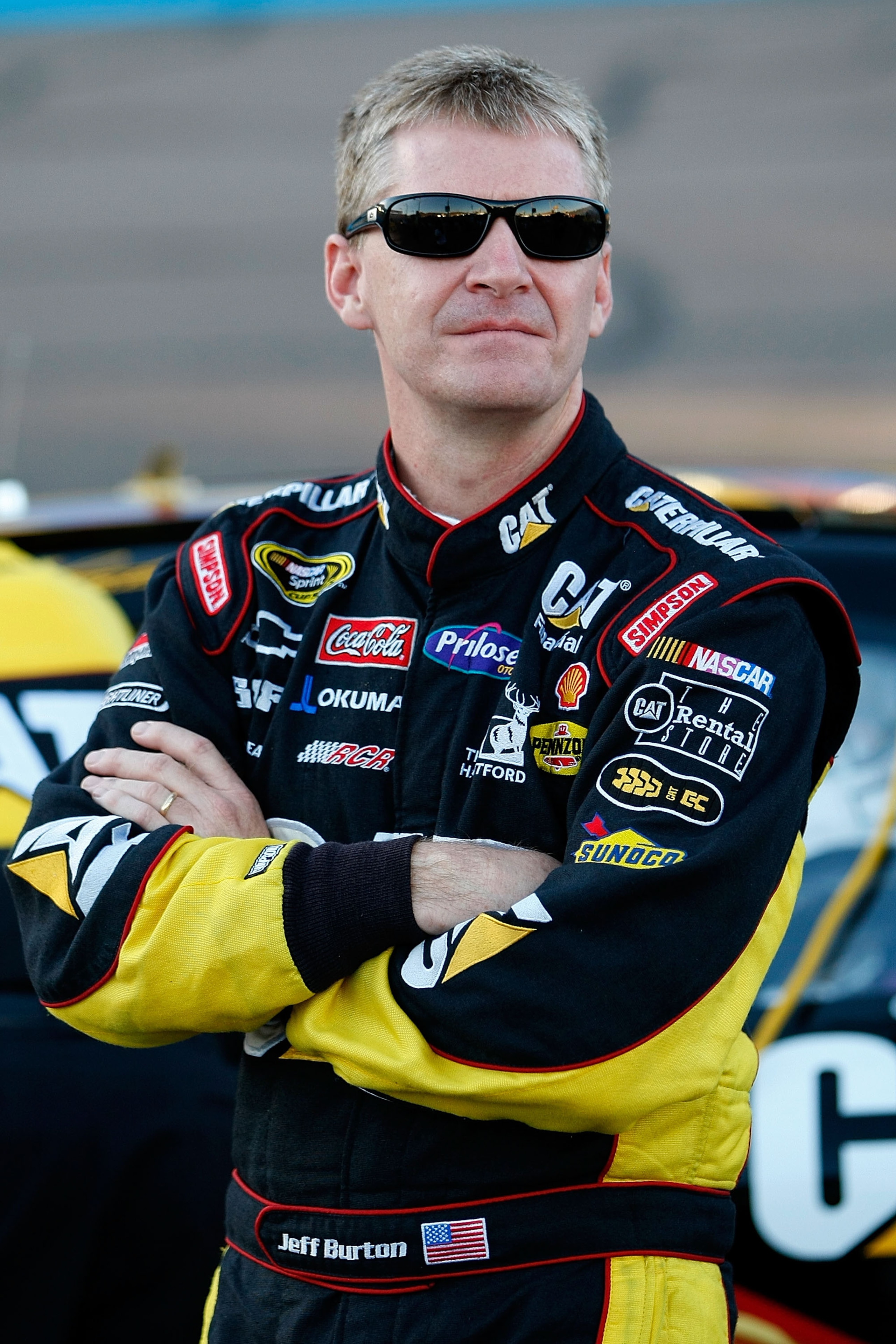 AVONDALE, AZ - NOVEMBER 12: Jeff Burton, driver of the #33 Caterpillar Chevrolet, stands on pit road during qualifying for the NASCAR Sprint Cup Series Kobalt Tools 500 at Phoenix International Raceway on November 12, 2010 in Avondale, Arizona.  (Photo by