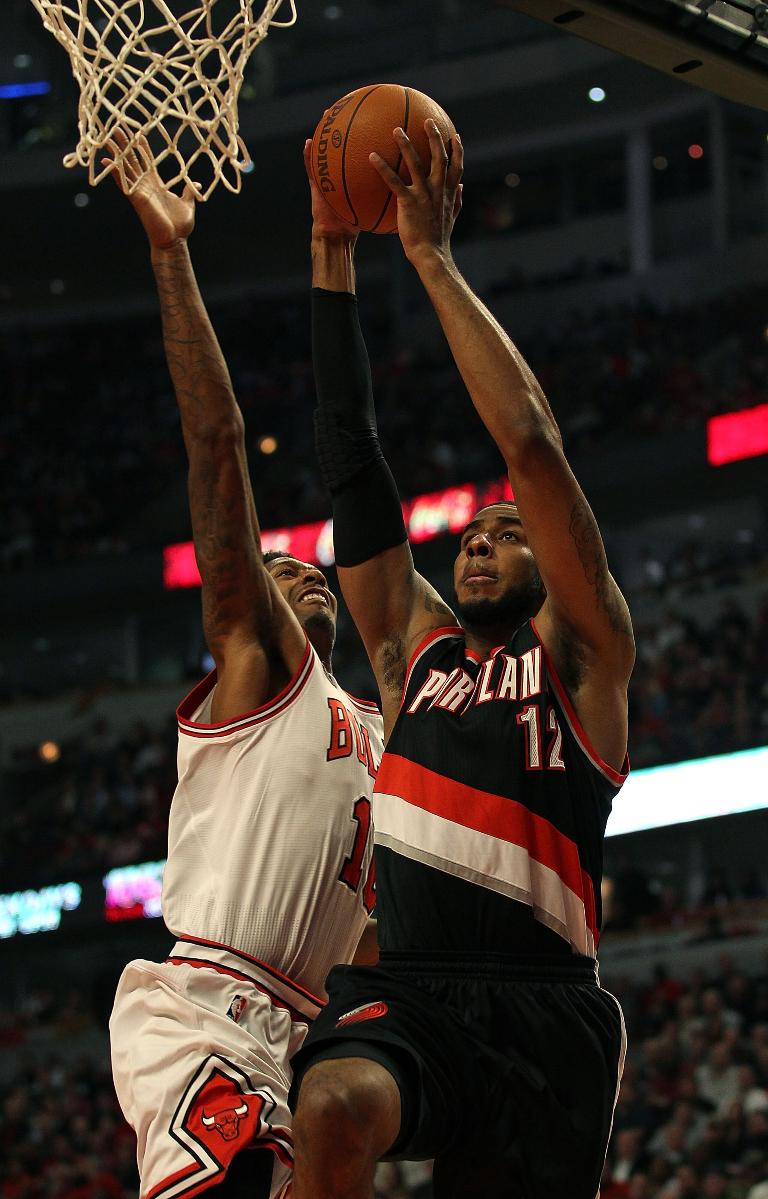 CHICAGO - NOVEMBER 01: LaMarcus Aldridge #12 of the Portland Trail Blazers goes up for a shot against James Johnson #16 of the Chicago Bulls at the United Center on November 1, 2010 in Chicago, Illinois. The Bulls defeated the Trail Blazers 110-98. NOTE T