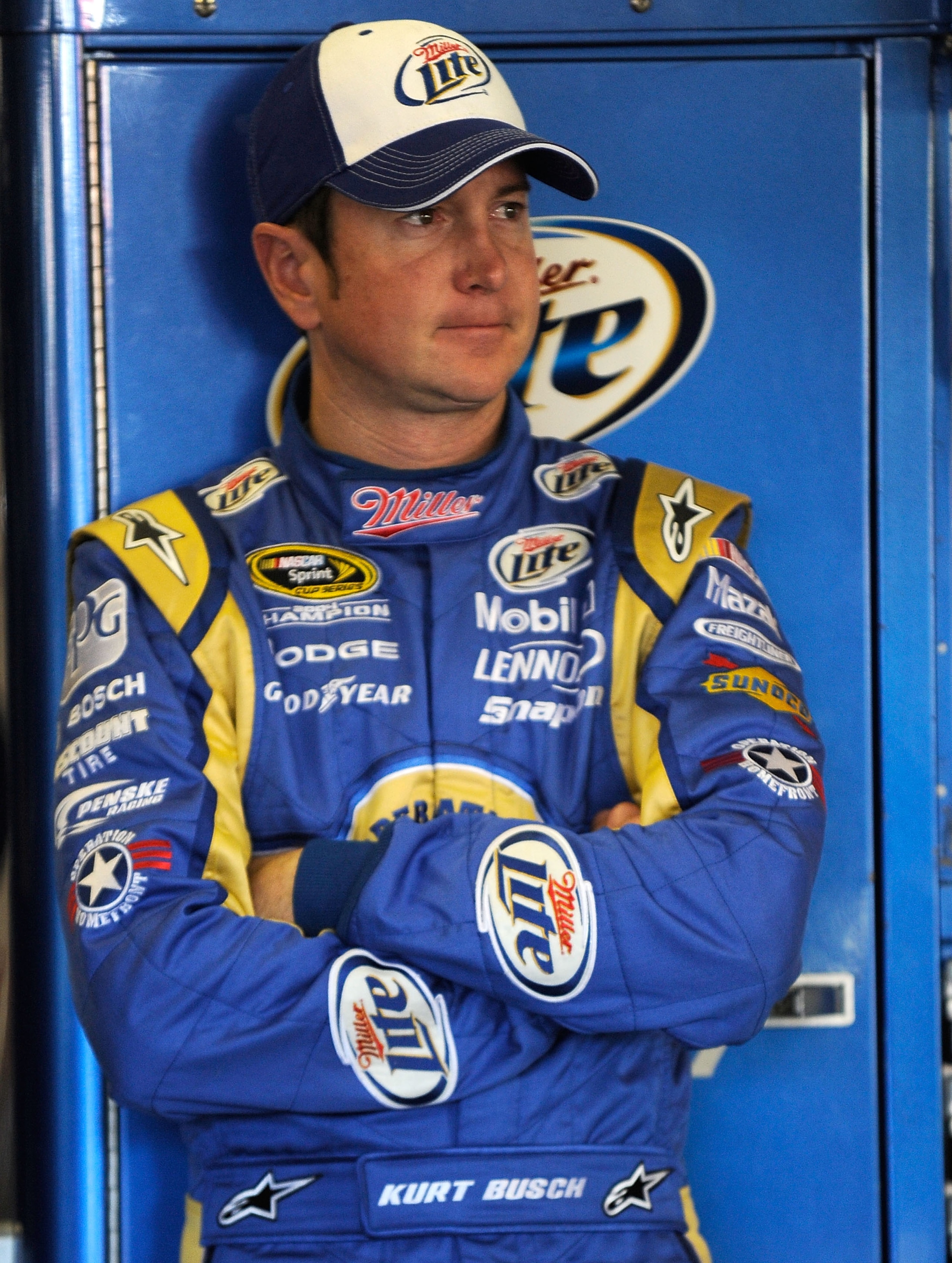 FORT WORTH, TX - NOVEMBER 06:  Kurt Busch, driver of the #2 Operation Home Front/Miller Lite Dodge, stands in the garage area during practice for the NASCAR Sprint Cup Series AAA Texas 500 at Texas Motor Speedway on November 6, 2010 in Fort Worth, Texas.