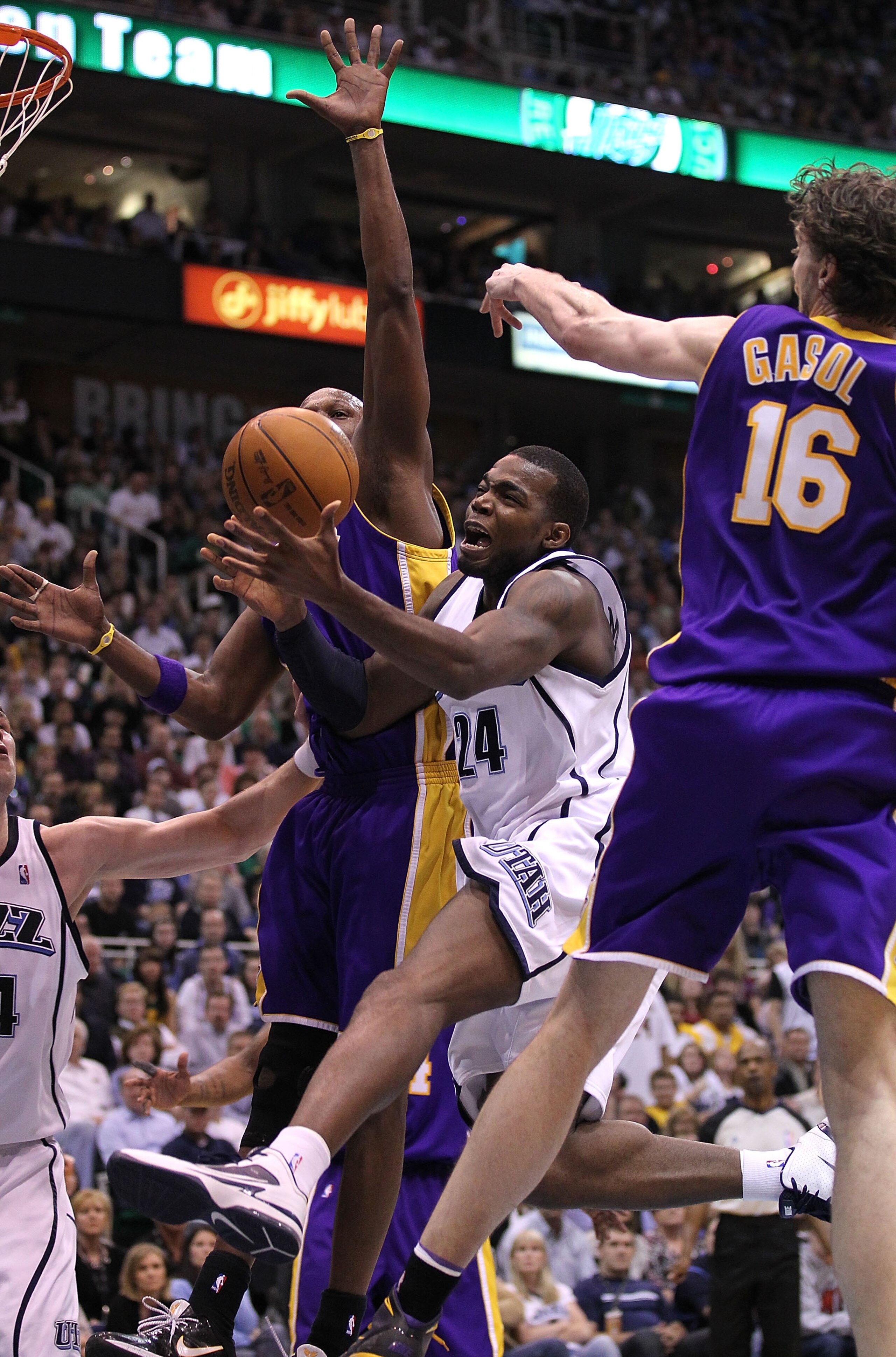 SALT LAKE CITY - MAY 10:  Paul Millsap #24 of the Utah Jazz shoots against Pau Gasol #16 and Lamar Odom #7 of the Los Angeles Lakers during Game Four of the Western Conference Semifinals of the 2010 NBA Playoffs on May 10, 2010 at Energy Solutions Arena i