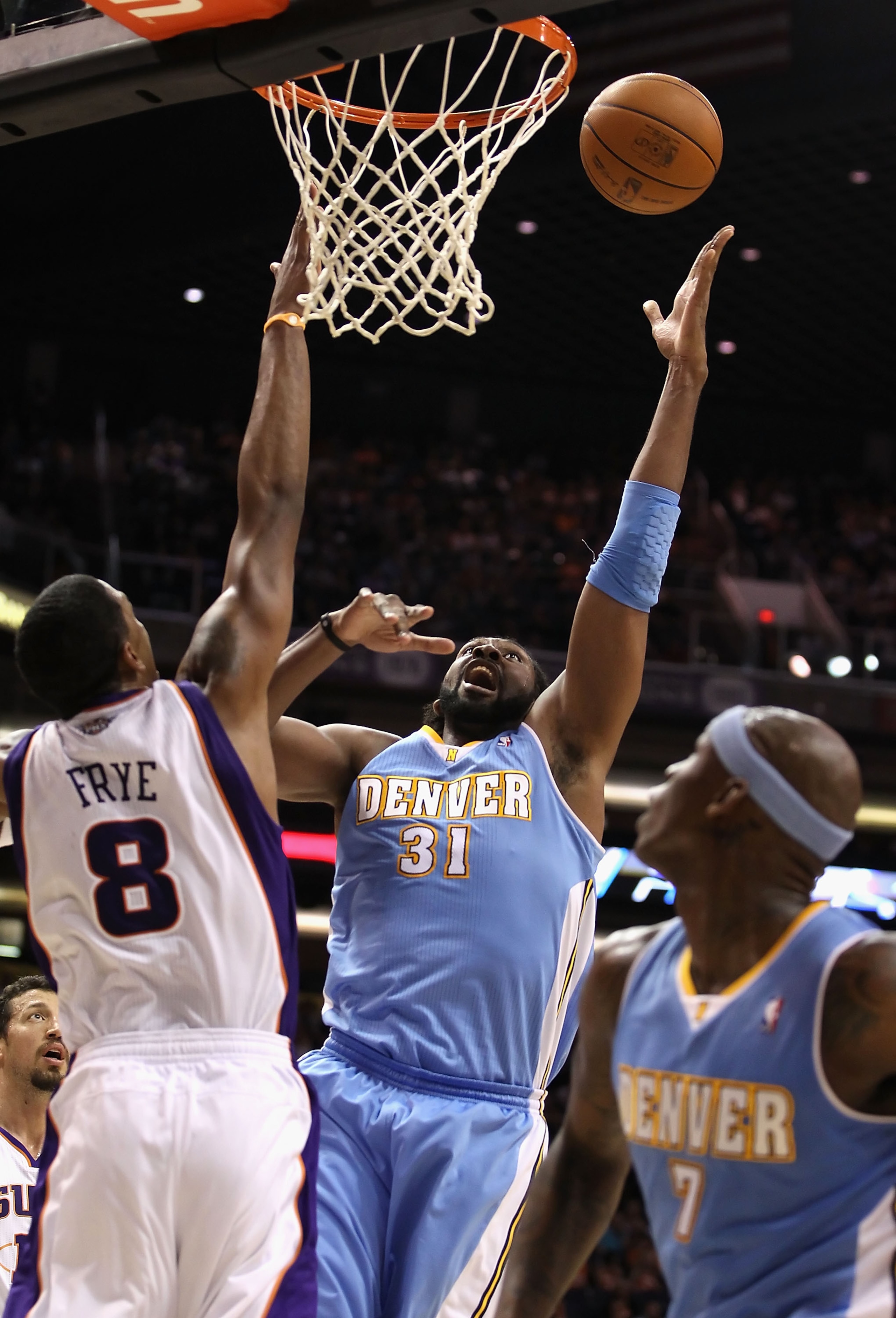 PHOENIX - NOVEMBER 15:  Nene #31 of the Denver Nuggets puts up a shot against the Phoenix Suns during the NBA game at US Airways Center on November 15, 2010 in Phoenix, Arizona.  The Suns defeated the Nuggets 100-94.  NOTE TO USER: User expressly acknowle