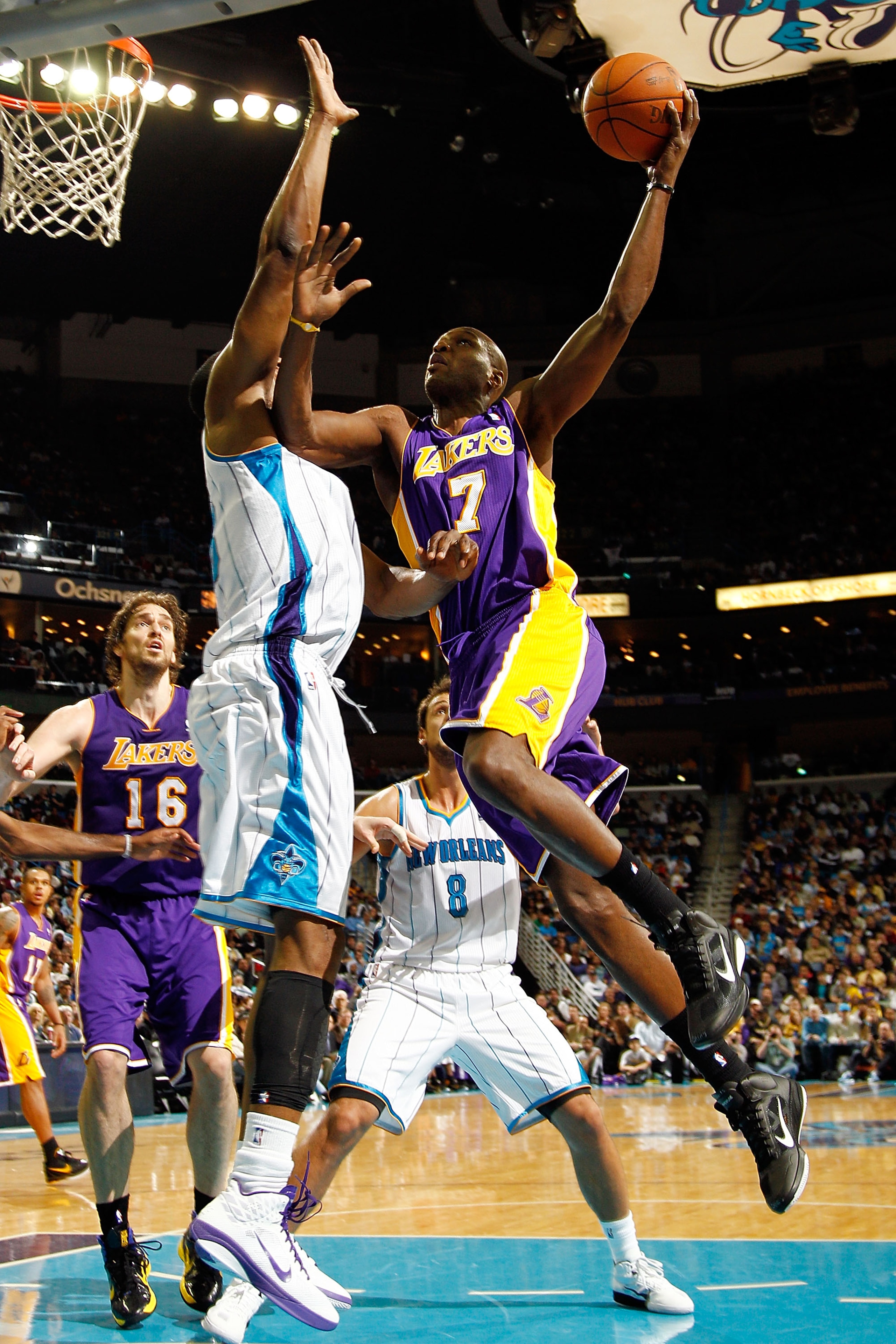 NEW ORLEANS, LA - DECEMBER 29:  Lamar Odom #7 of the Los Angeles Lakers shoots the ball over D.J. Mbenga #28 of the New Orleans Hornets at the New Orleans Arena on December 29, 2010 in New Orleans, Louisiana.   The Lakers defeated the Hornets 103-88.  NOT