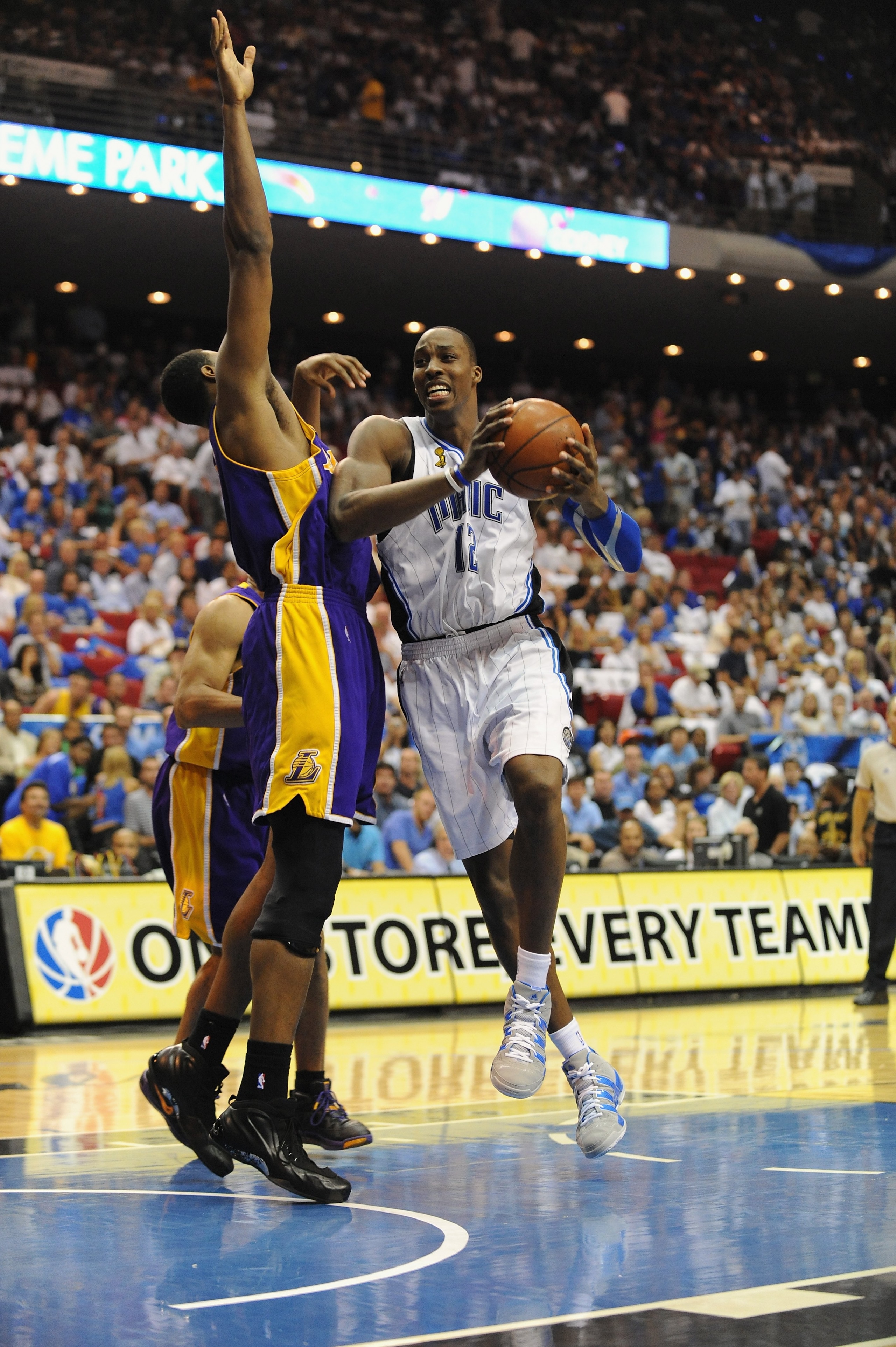 ORLANDO, FL - JUNE 14:  Dwight Howard #12 of the Orlando Magic moves through the lane against Andrew Bynum #17 of the Los Angeles Lakers in Game Five of the 2009 NBA Finals on June 14, 2009 at Amway Arena in Orlando, Florida. The Lakers won 99-86.  NOTE T