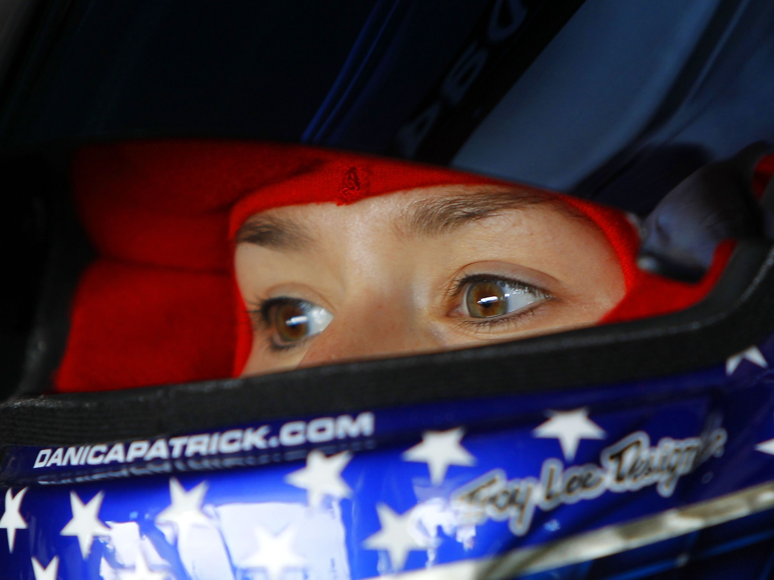 HOMESTEAD, FL - NOVEMBER 19:  Danica Patrick, driver of the #7 GoDaddy.com Chevrolet, sits in her car during practice for the NASCAR Nationwide Series Ford 300 at Homestead-Miami Speedway on November 19, 2010 in Homestead, Florida.  (Photo by Chris Trotma