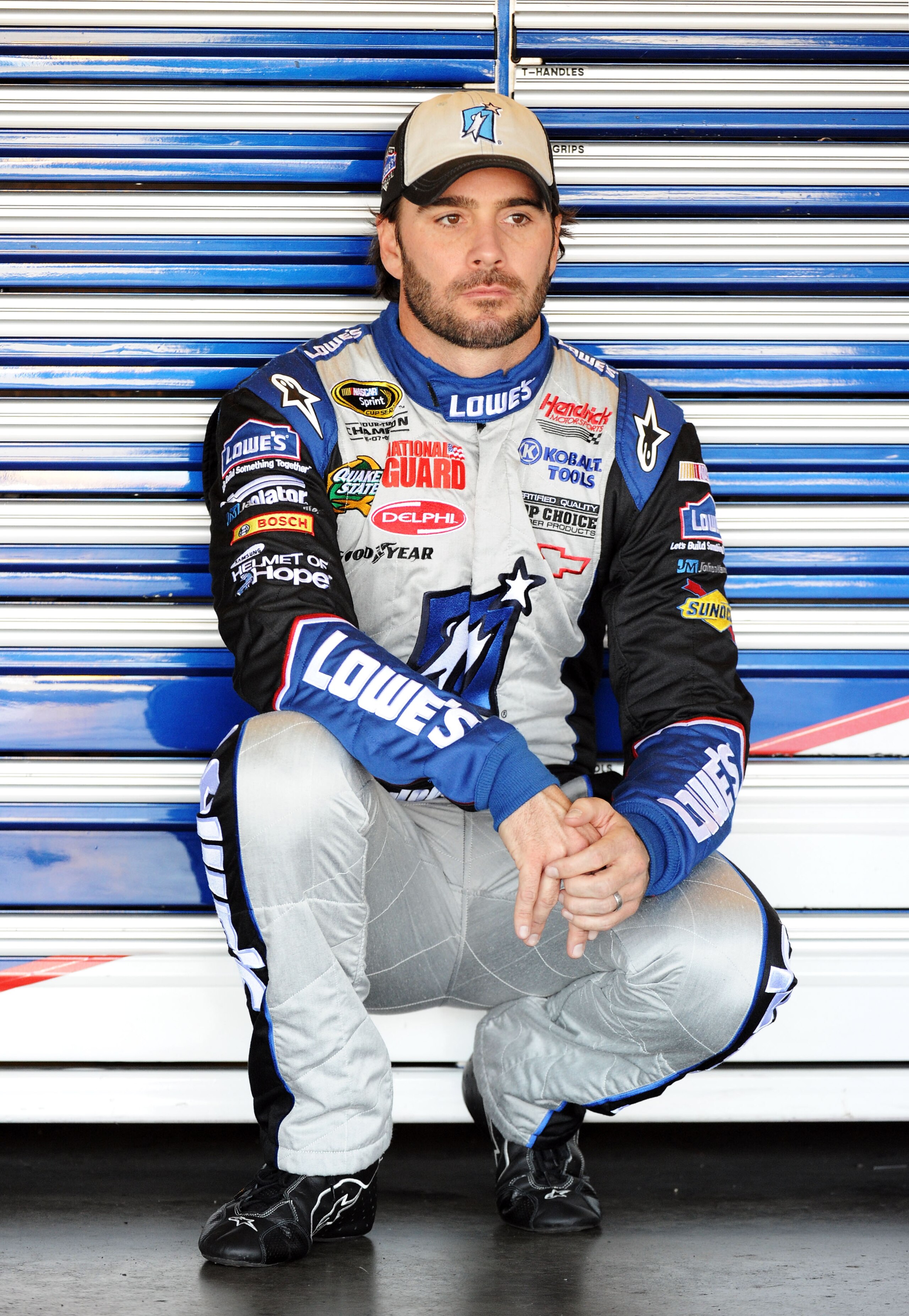 FONTANA, CA - OCTOBER 09:  Jimmie Johnson, driver of the #48 Lowe's/Jimmie Johnson Foundation Chevrolet, waits in the garage during practice for the NASCAR Sprint Cup Series Pepsi Max 400 on October 9, 2010 in Fontana, California.  (Photo by Harry How/Get