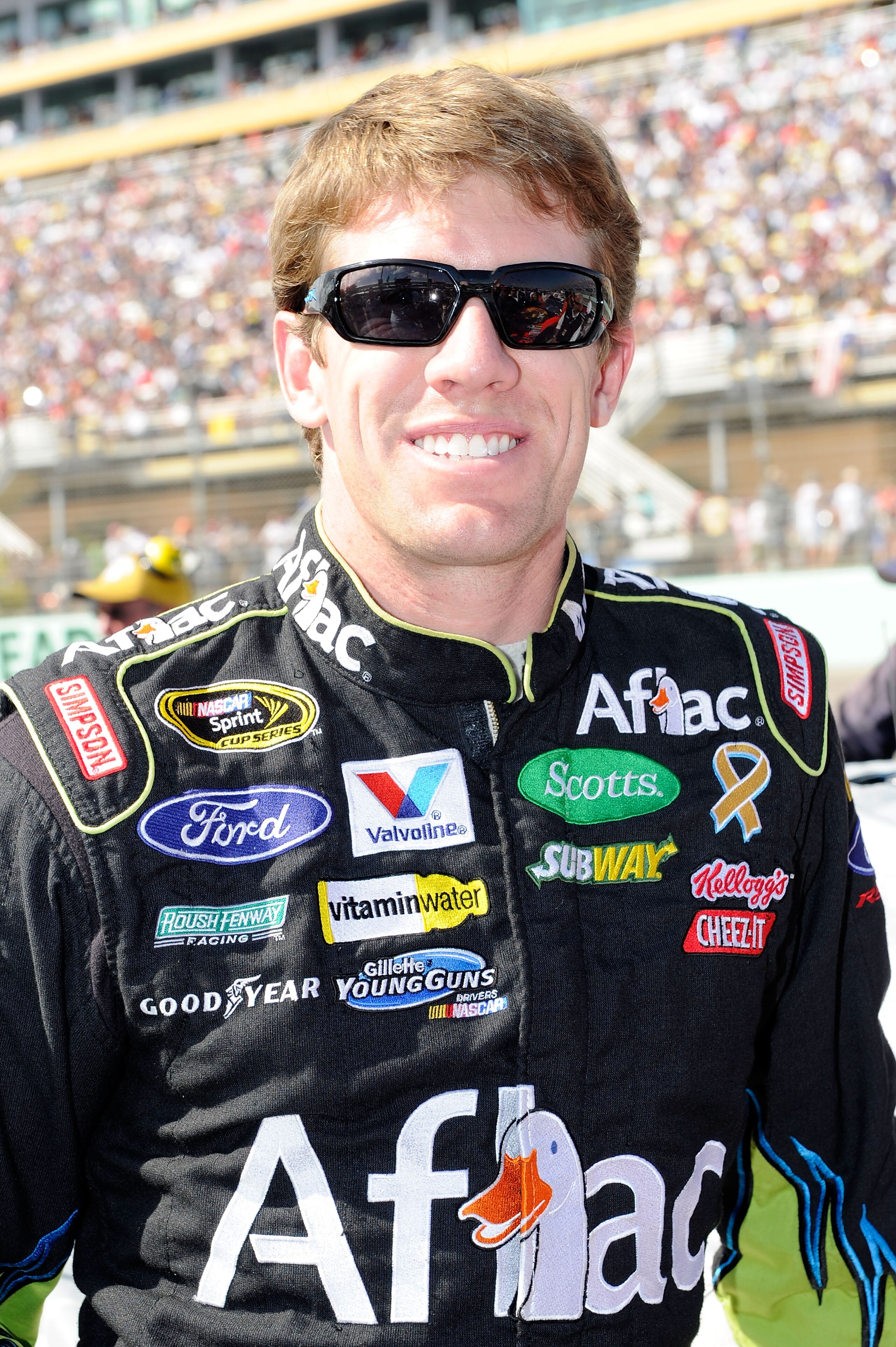 HOMESTEAD, FL - NOVEMBER 21:  Carl Edwards, driver of the #99 Aflac Ford, stands on pit road prior to the NASCAR Sprint Cup Series Ford 400 at Homestead-Miami Speedway on November 21, 2010 in Homestead, Florida.  (Photo by John Harrelson/Getty Images for