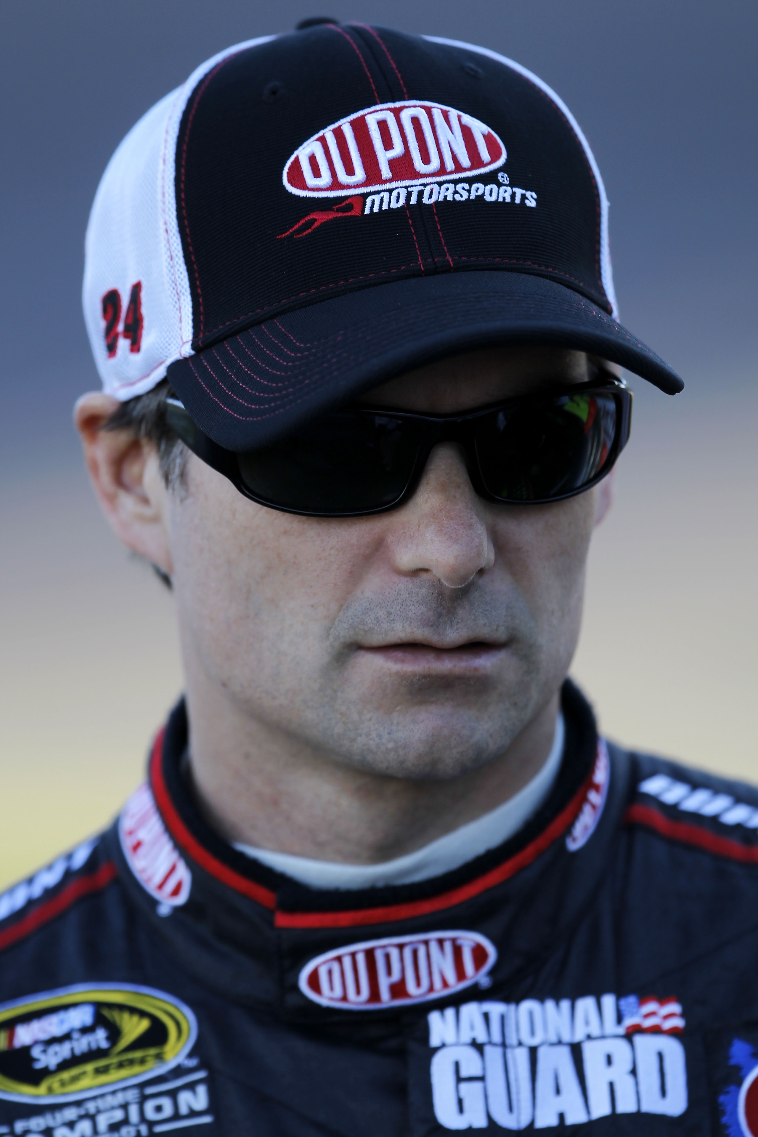 AVONDALE, AZ - NOVEMBER 12:  Jeff Gordon, driver of the #24 DuPont Chevrolet, stands on pit road during qualifying for the NASCAR Sprint Cup Series Kobalt Tools 500 at Phoenix International Raceway on November 12, 2010 in Avondale, Arizona.  (Photo by Chr
