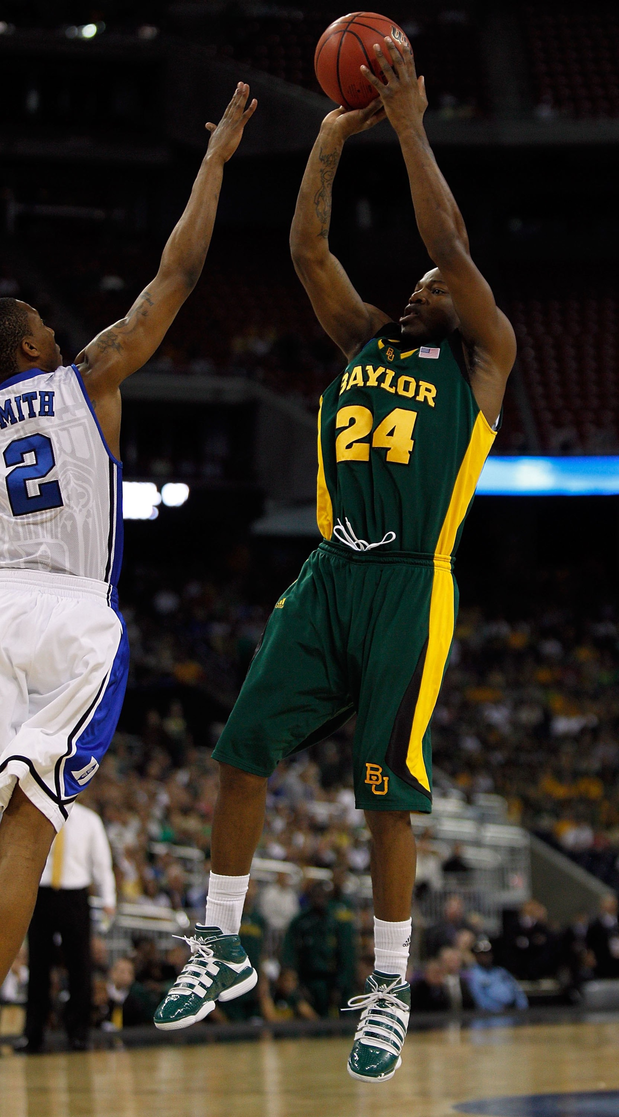 HOUSTON - MARCH 28: LaceDarius Dunn #24 of the Baylor Bears puts up a shot over Nolan Smith #2 of the Duke Blue Devils during the south regional final of the 2010 NCAA men's basketball tournament at Reliant Stadium on March 28, 2010 in Houston, Texas. Duk HOUSTON - MARCH 28: LaceDarius Dunn #24 of the Baylor Bears puts up a shot over Nolan Smith #2 of the Duke Blue Devils during the south regional final of the 2010 NCAA men's basketball tournament at Reliant Stadium on March 28, 2010 in Houston, Texas. Duk